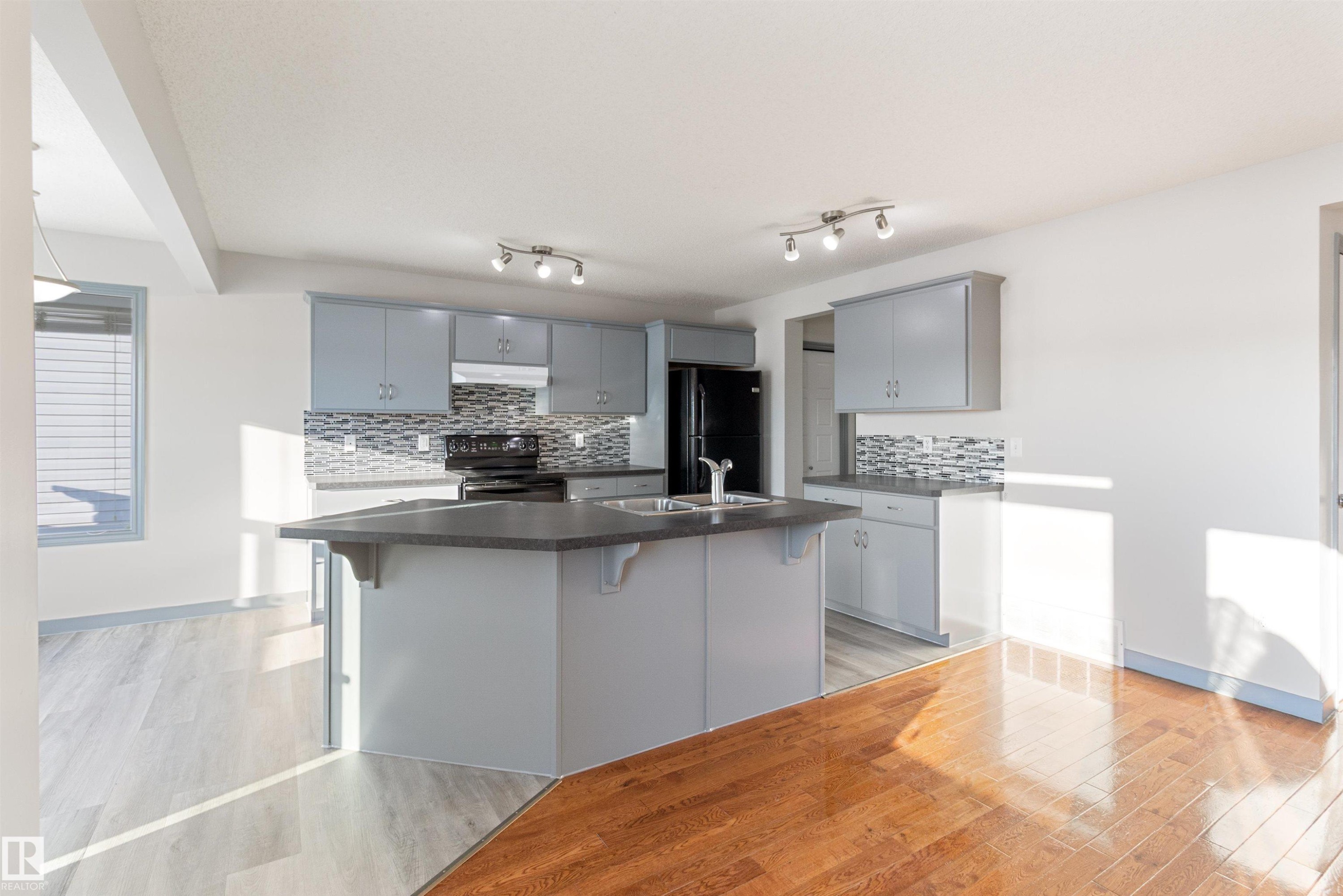 75 Dunlop Wynd, Leduc, AB - Indoor Photo Showing Kitchen With Double Sink