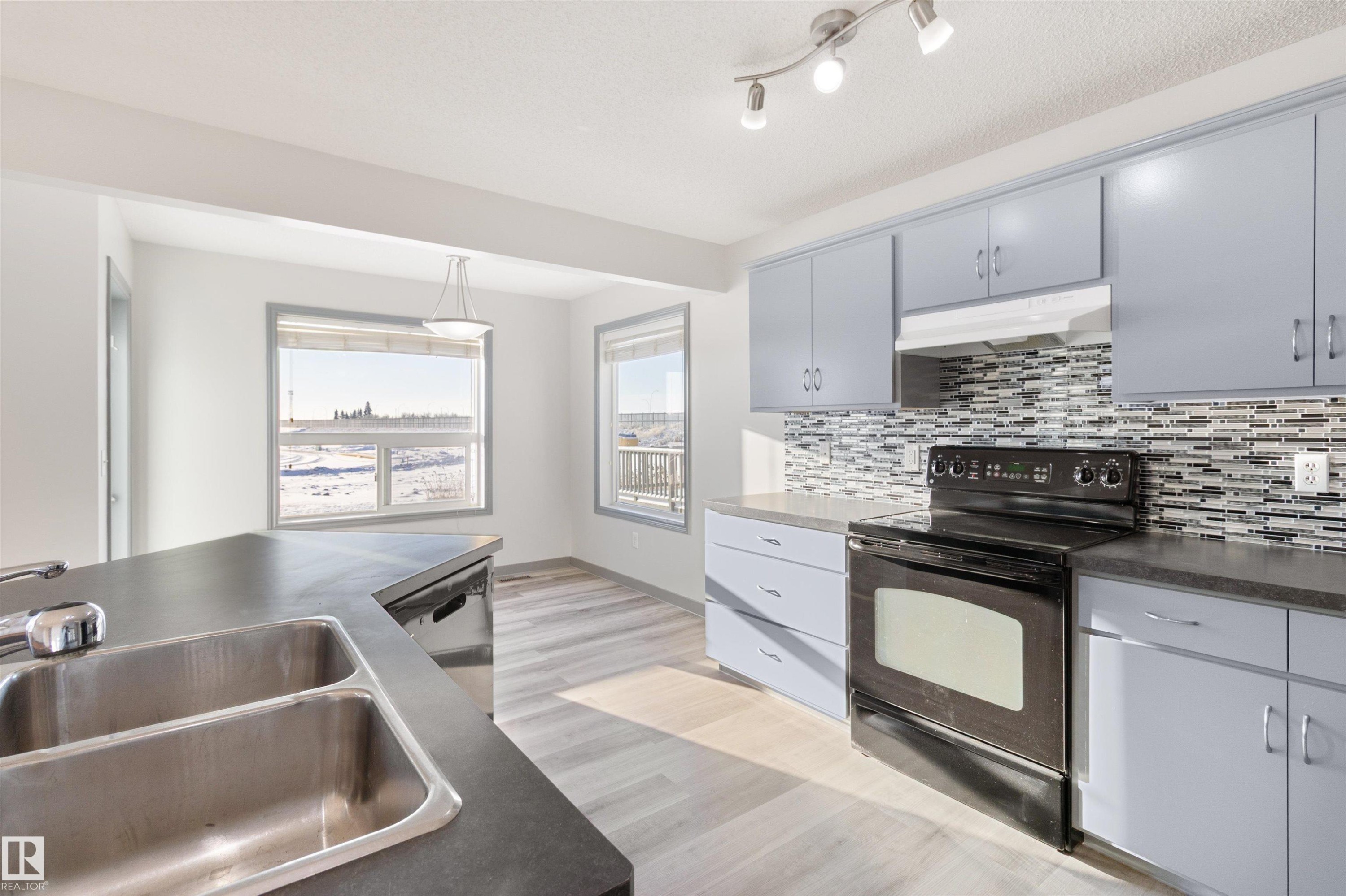 75 Dunlop Wynd, Leduc, AB - Indoor Photo Showing Kitchen With Double Sink