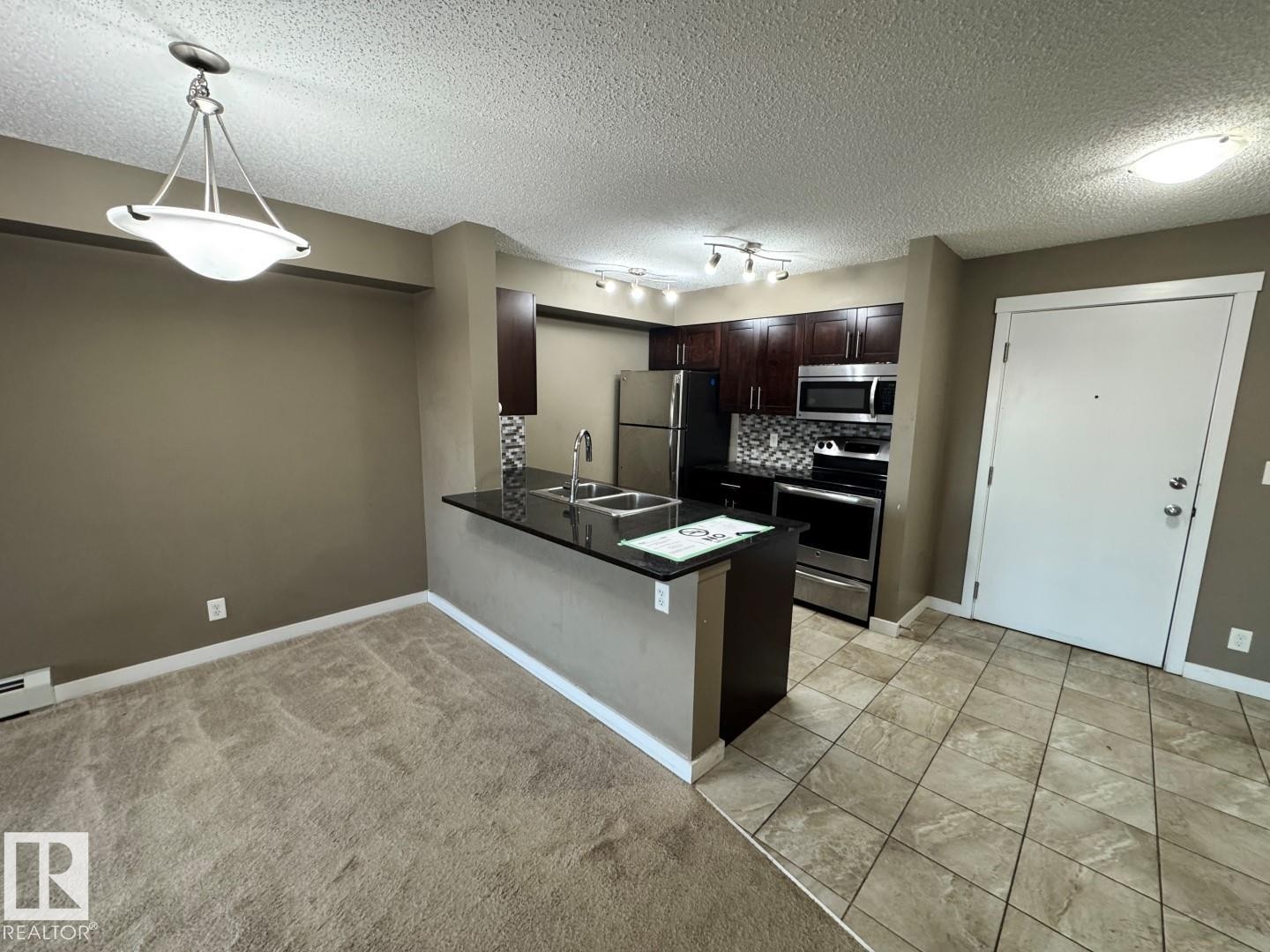 421 107 Watt Common, Edmonton, AB - Indoor Photo Showing Kitchen With Double Sink