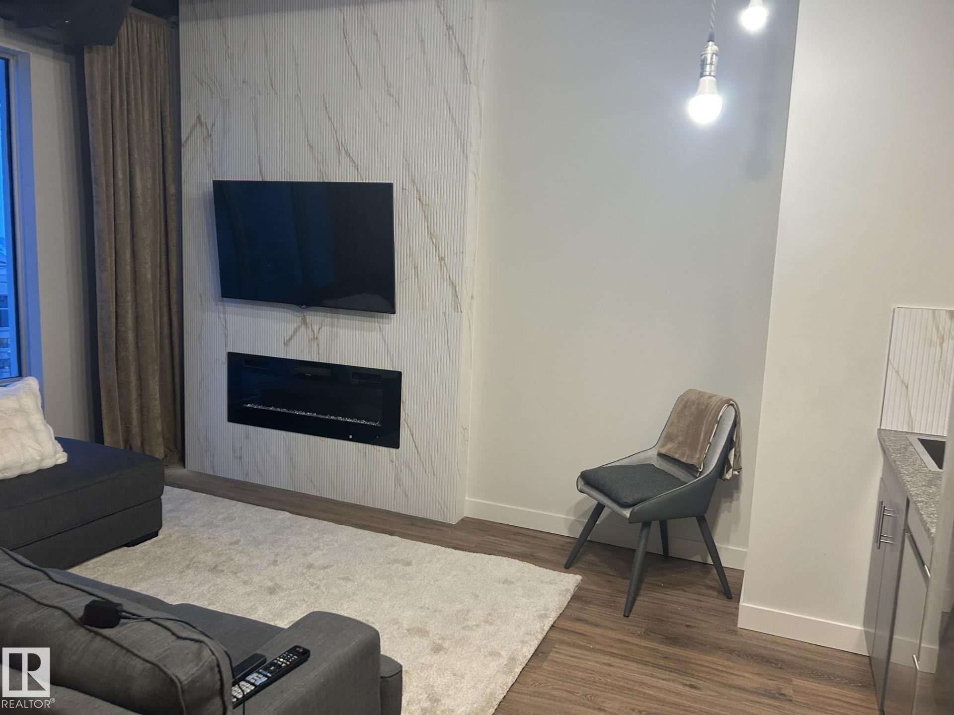 Edmonton, AB - Indoor Photo Showing Living Room With Fireplace