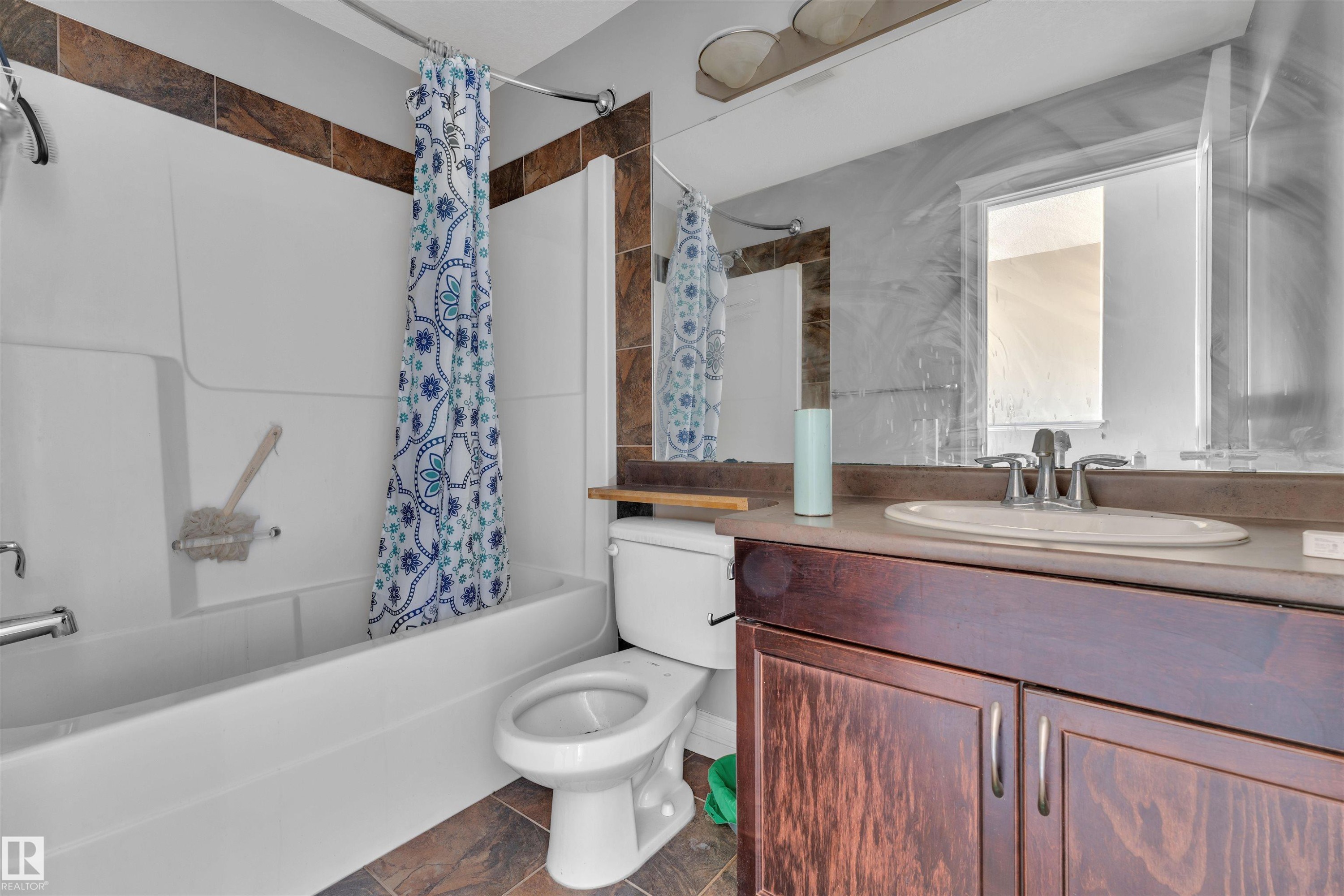 Bathroom featuring shower / tub combo with curtain and vanity - 3015 26 Ave Nw, Edmonton, AB - Indoor Photo Showing Bathroom