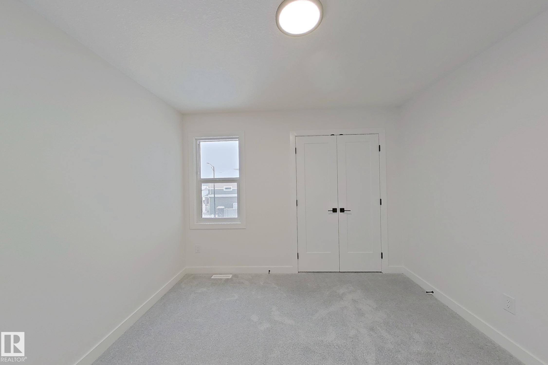 Unfurnished bedroom with carpet floors and a closet - 3158 Magpie Way, Edmonton, AB - Indoor Photo Showing Other Room