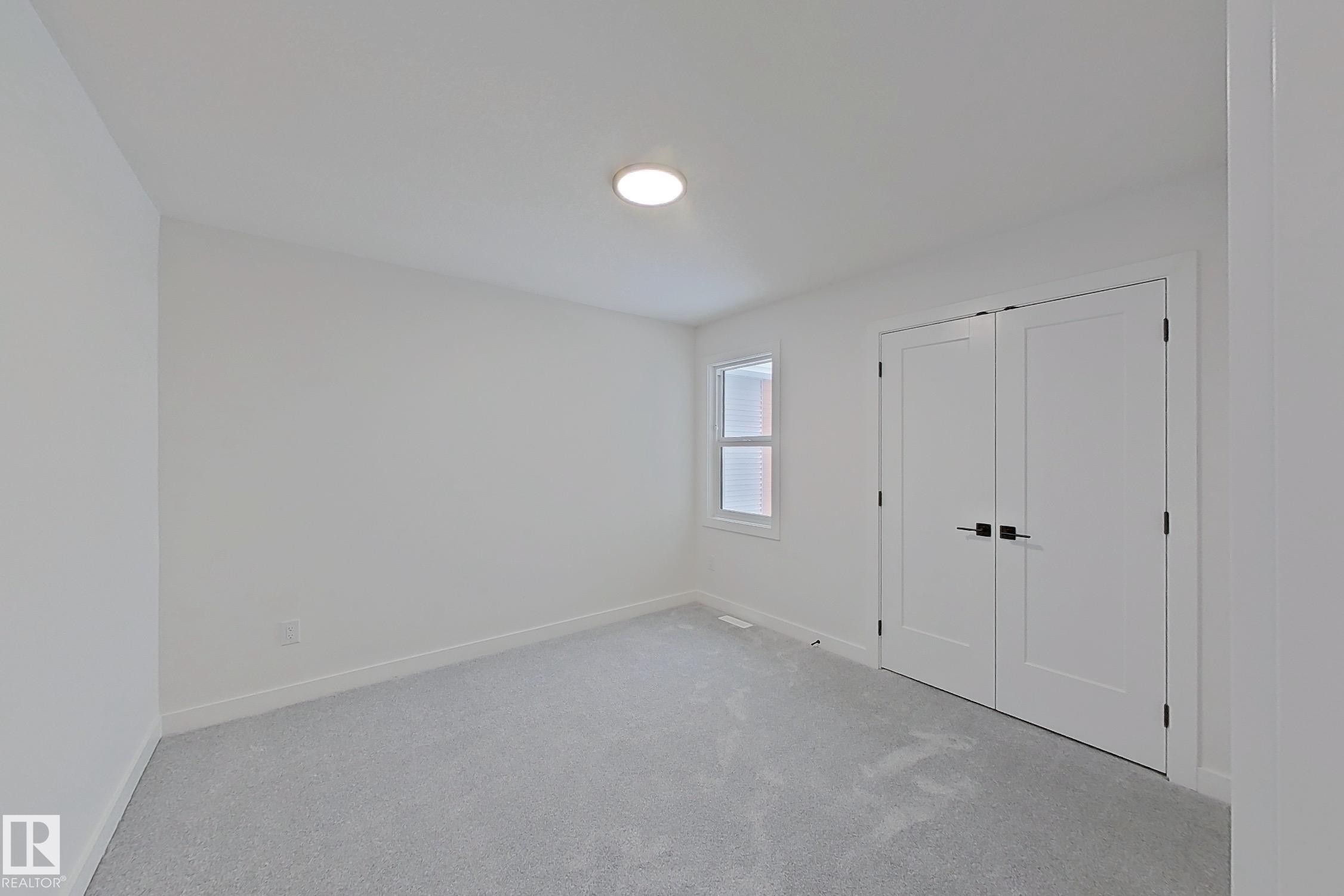 Unfurnished bedroom featuring carpet and a closet - 3158 Magpie Way, Edmonton, AB - Indoor Photo Showing Other Room