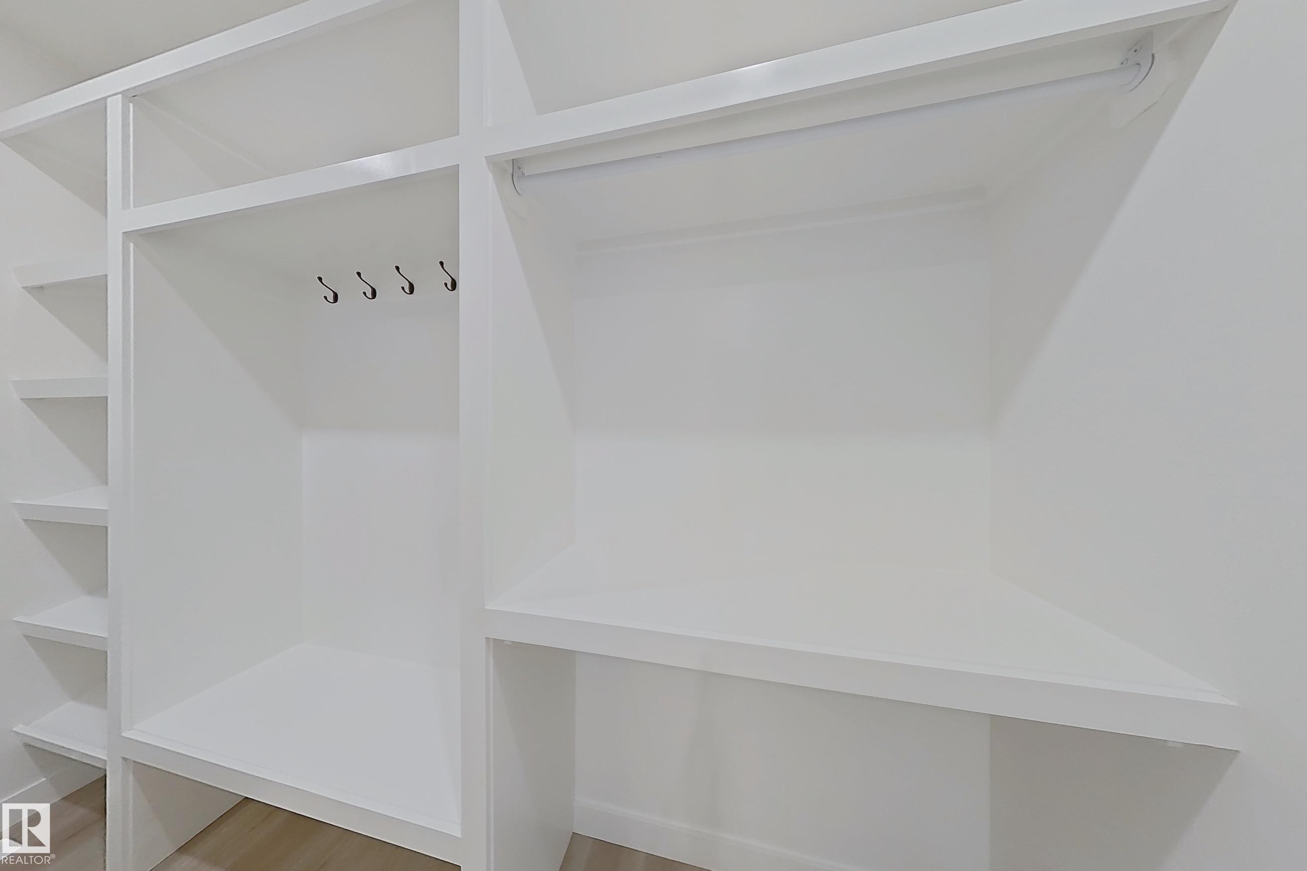 Mudroom featuring light wood-style flooring - 3158 Magpie Way, Edmonton, AB - Indoor With Storage