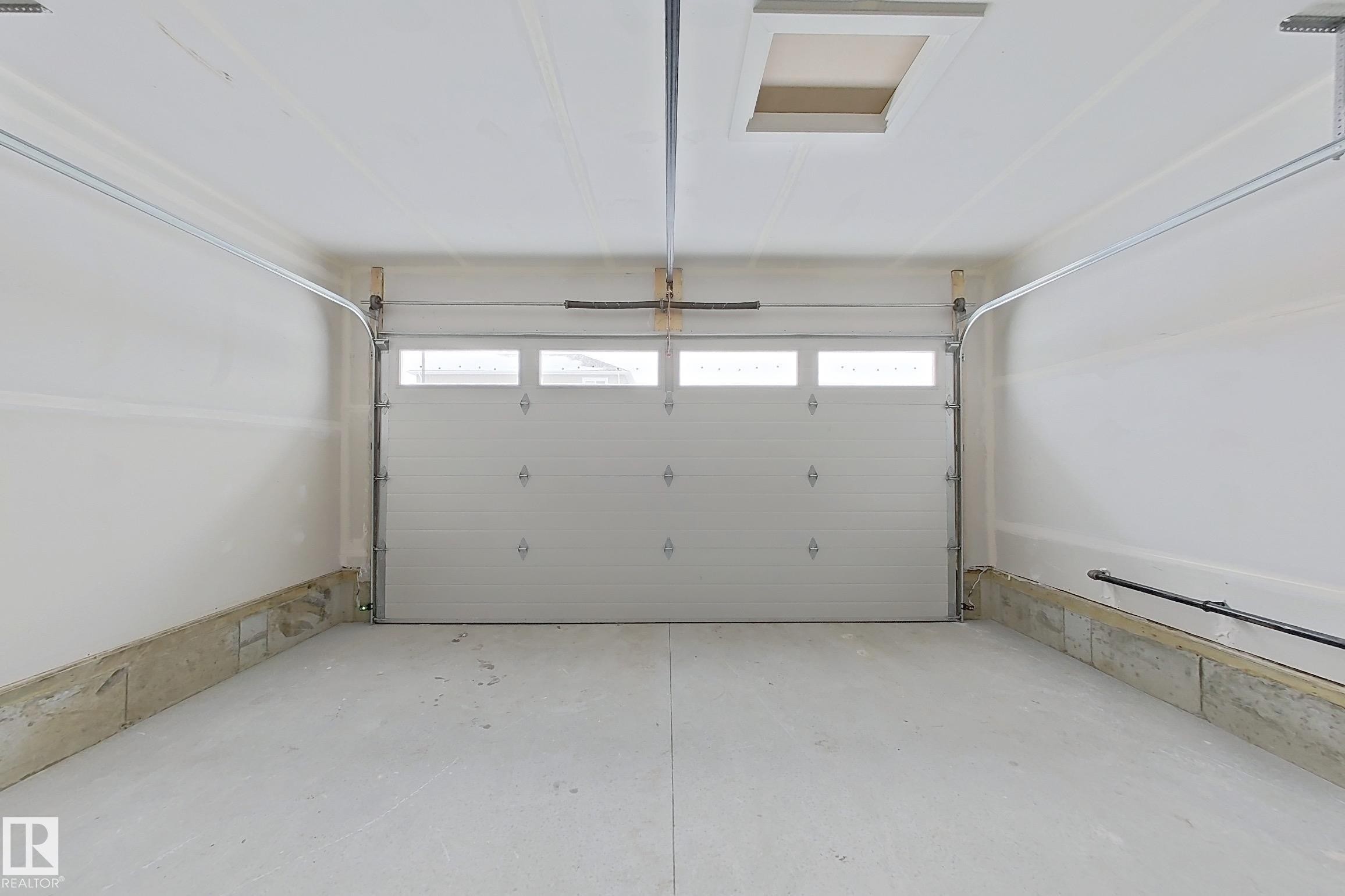 View of garage - 3158 Magpie Way, Edmonton, AB - Indoor Photo Showing Garage