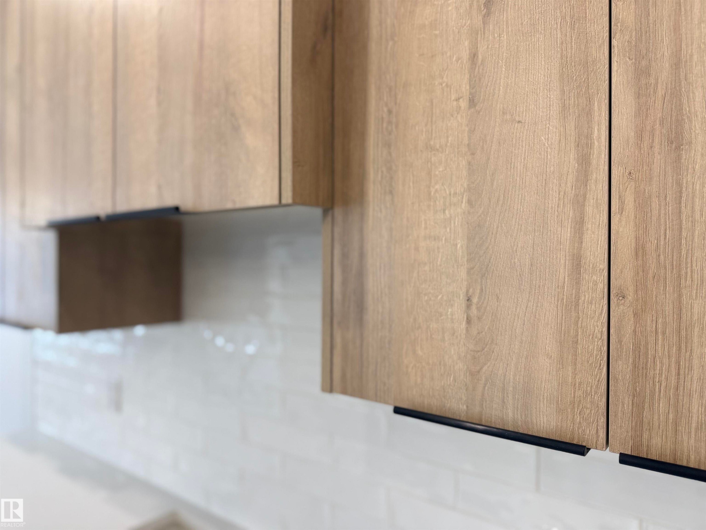Kitchen view of modern cabinets - 3158 Magpie Way, Edmonton, AB - Indoor Photo Showing Other Room