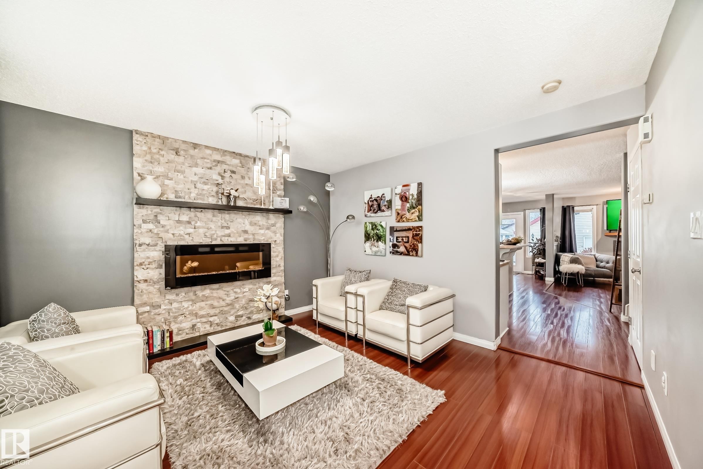 5819 Sutter Place, Edmonton, AB - Indoor Photo Showing Living Room With Fireplace