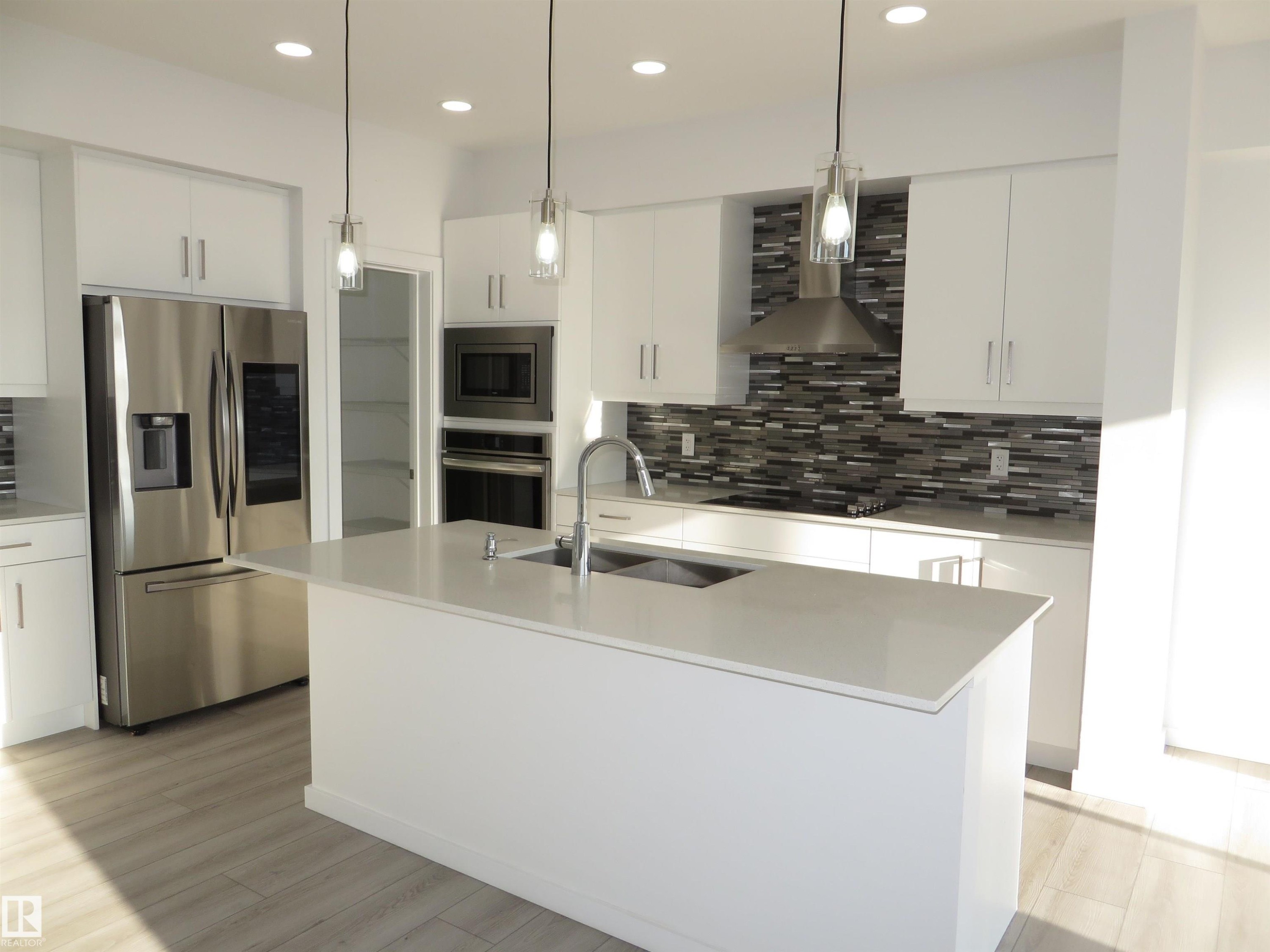 23 Sturtz Place, Leduc, AB - Indoor Photo Showing Kitchen With Double Sink With Upgraded Kitchen