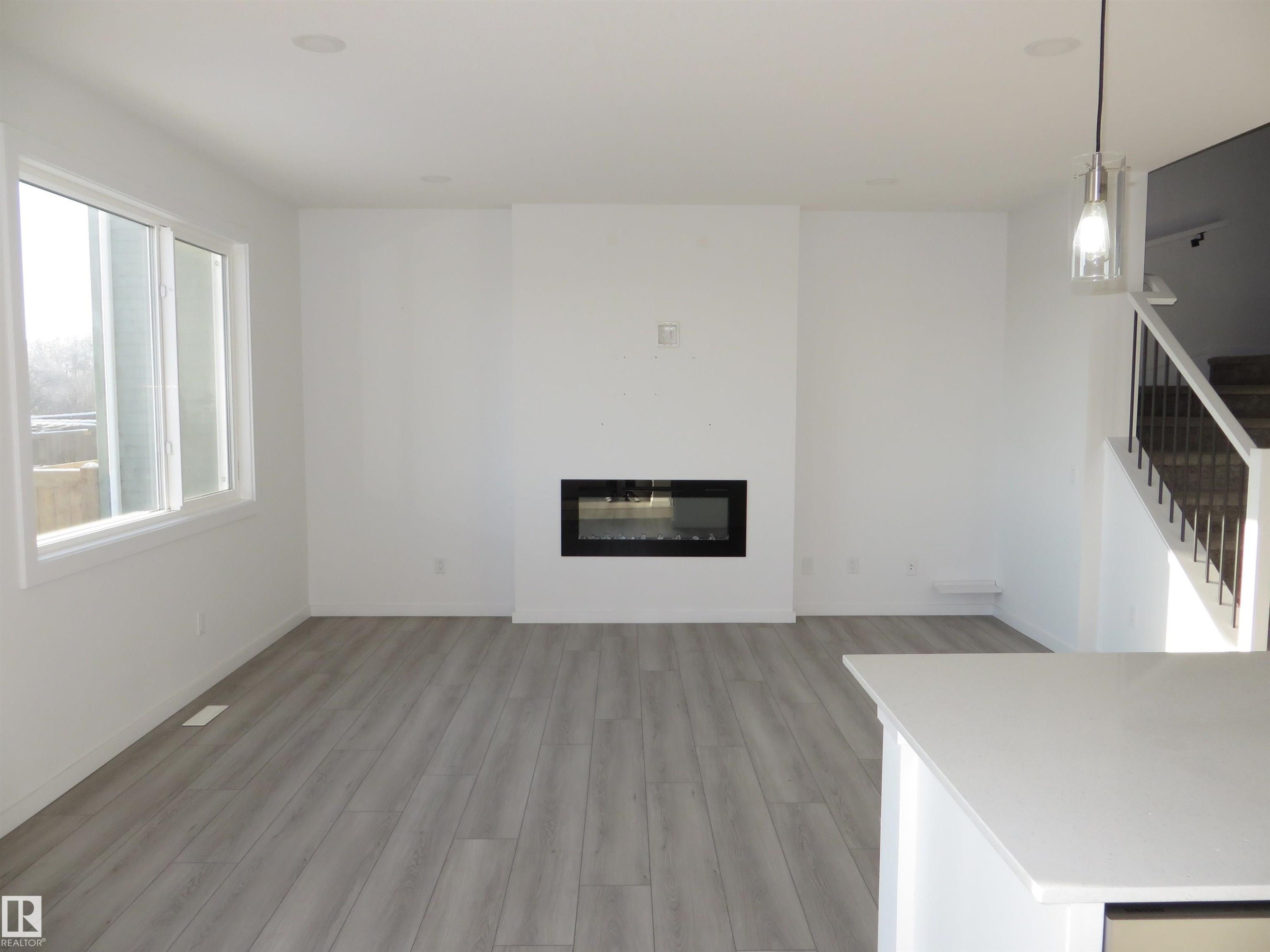 23 Sturtz Place, Leduc, AB - Indoor Photo Showing Living Room With Fireplace
