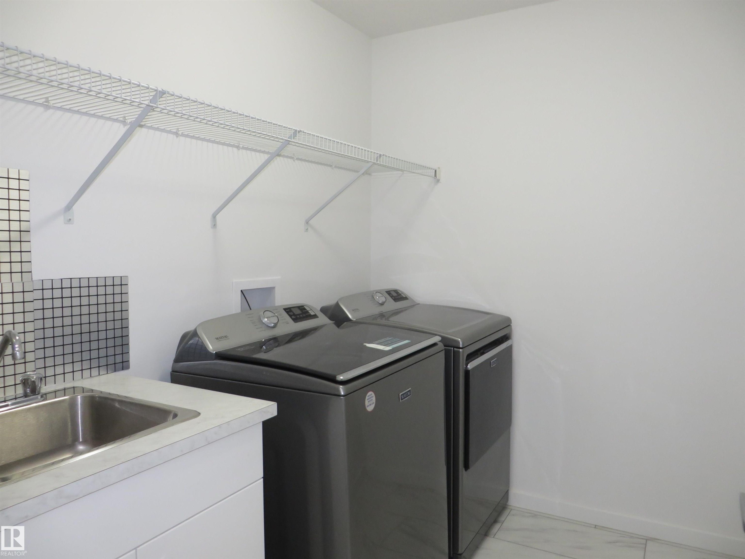 23 Sturtz Place, Leduc, AB - Indoor Photo Showing Laundry Room
