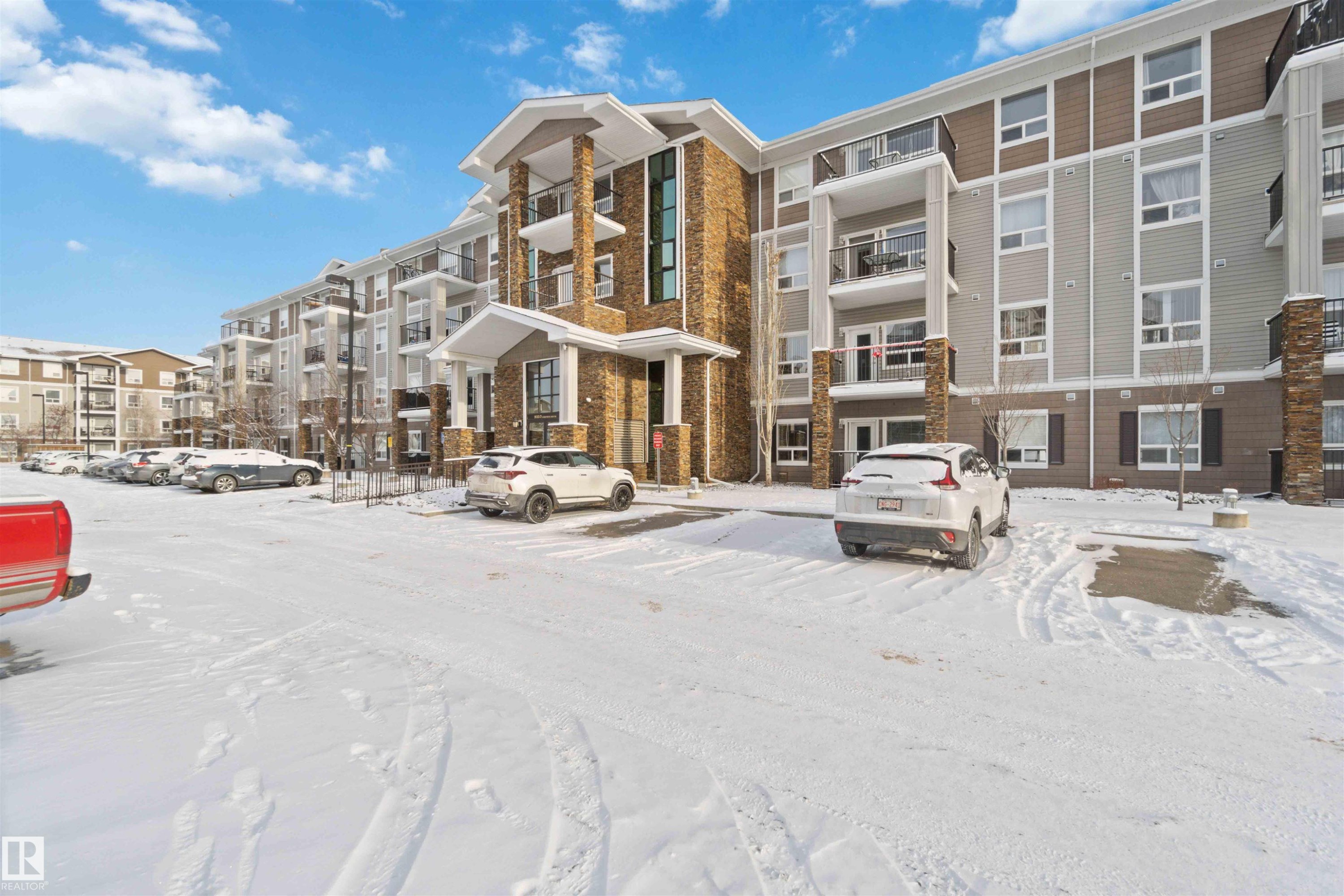 Snow covered property featuring a view of apartment building / complex - 2117 9357 Simpson Drive, Edmonton, AB - Outdoor With Facade
