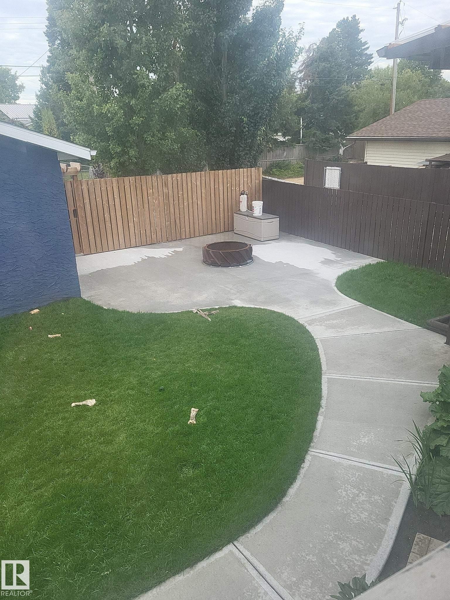 Fenced backyard featuring a patio - 4505 58 Avenue, Barrhead, AB - Outdoor