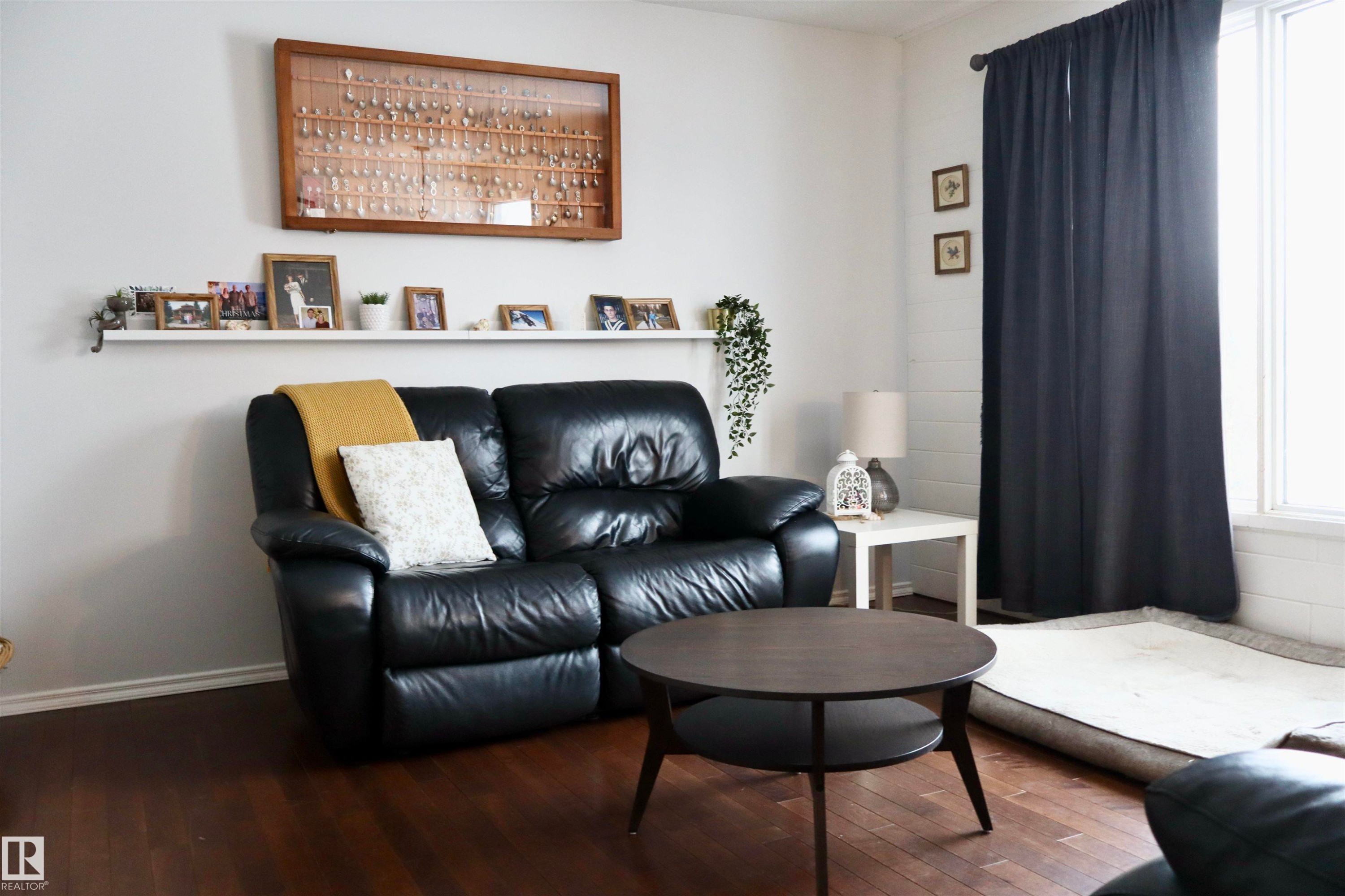 Living area featuring hardwood / wood-style flooring - 4505 58 Avenue, Barrhead, AB - Indoor Photo Showing Living Room