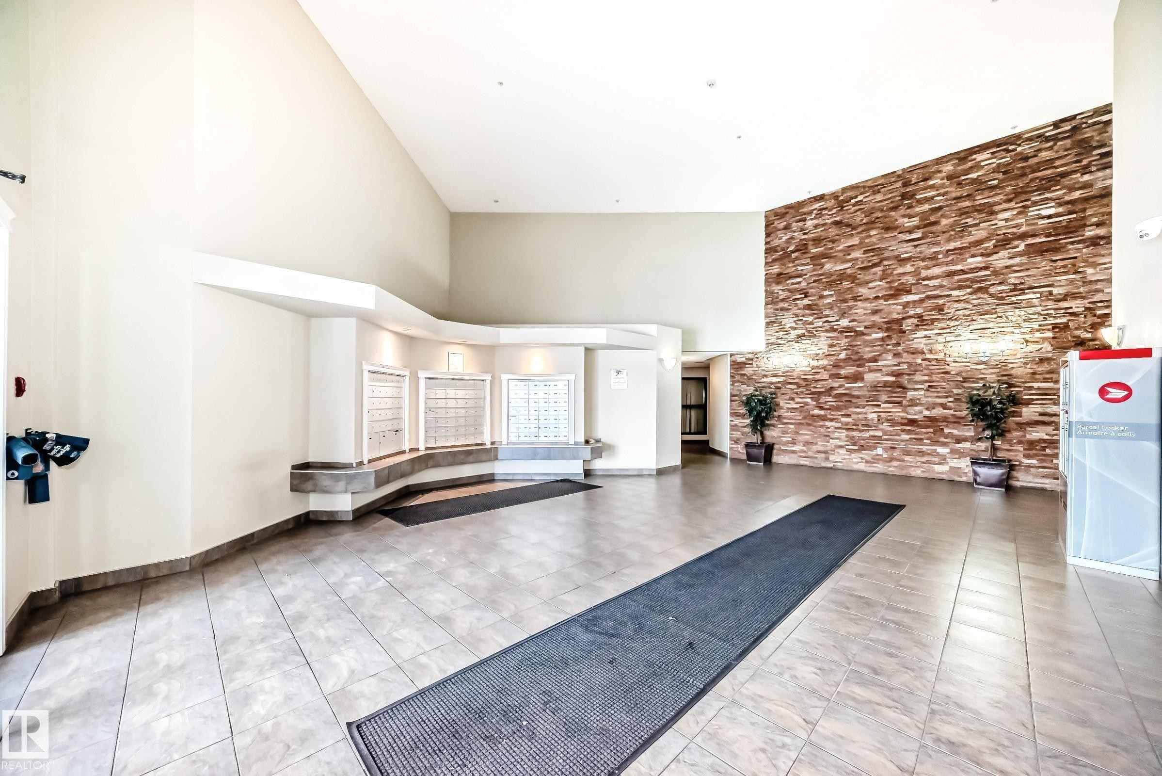 223 5350 199 Street, Edmonton, AB - Indoor Photo Showing Other Room With Fireplace