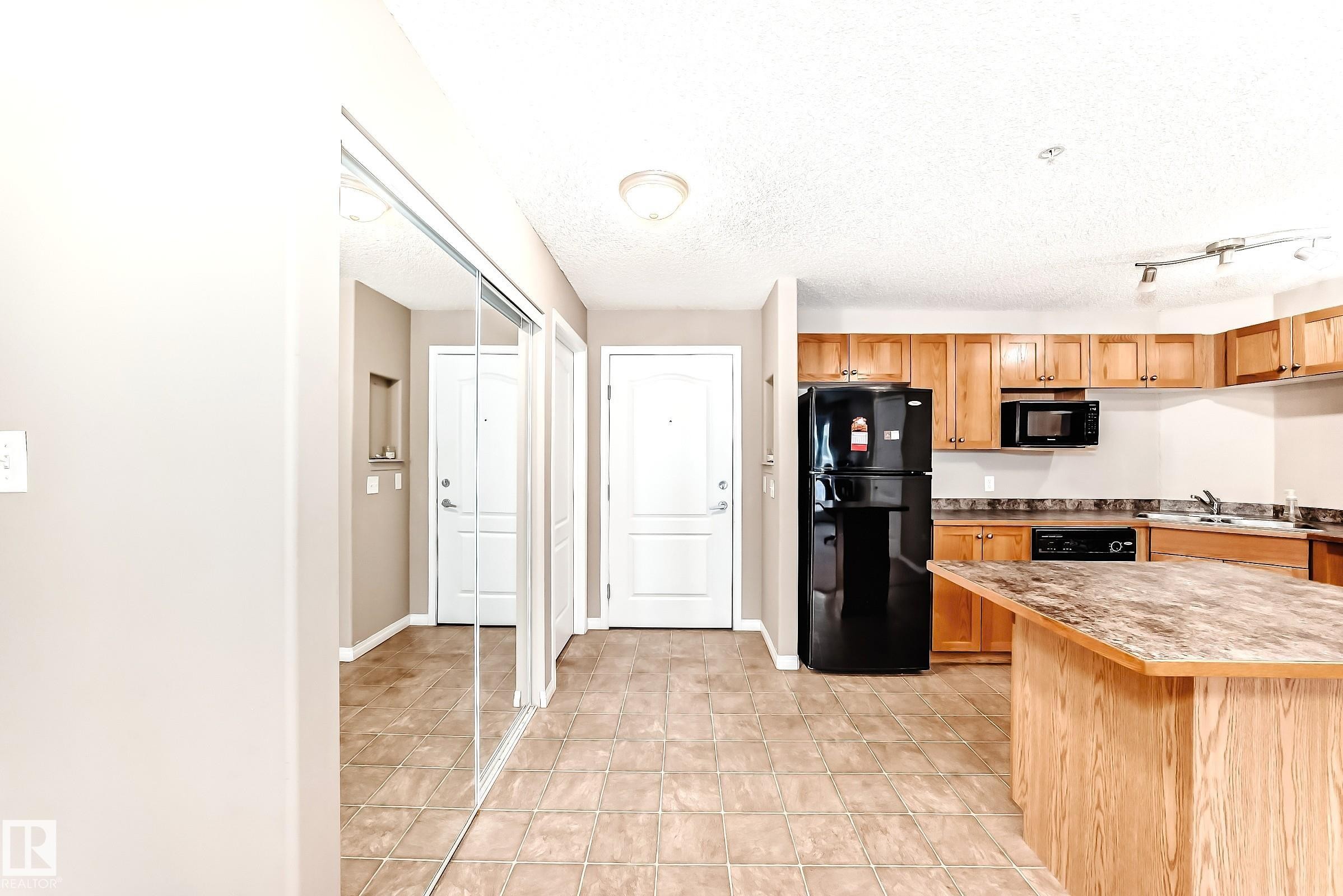 223 5350 199 Street, Edmonton, AB - Indoor Photo Showing Kitchen With Double Sink