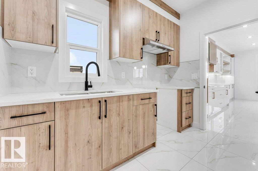 221 Crystal Creek Drive, Leduc, AB - Indoor Photo Showing Kitchen With Double Sink