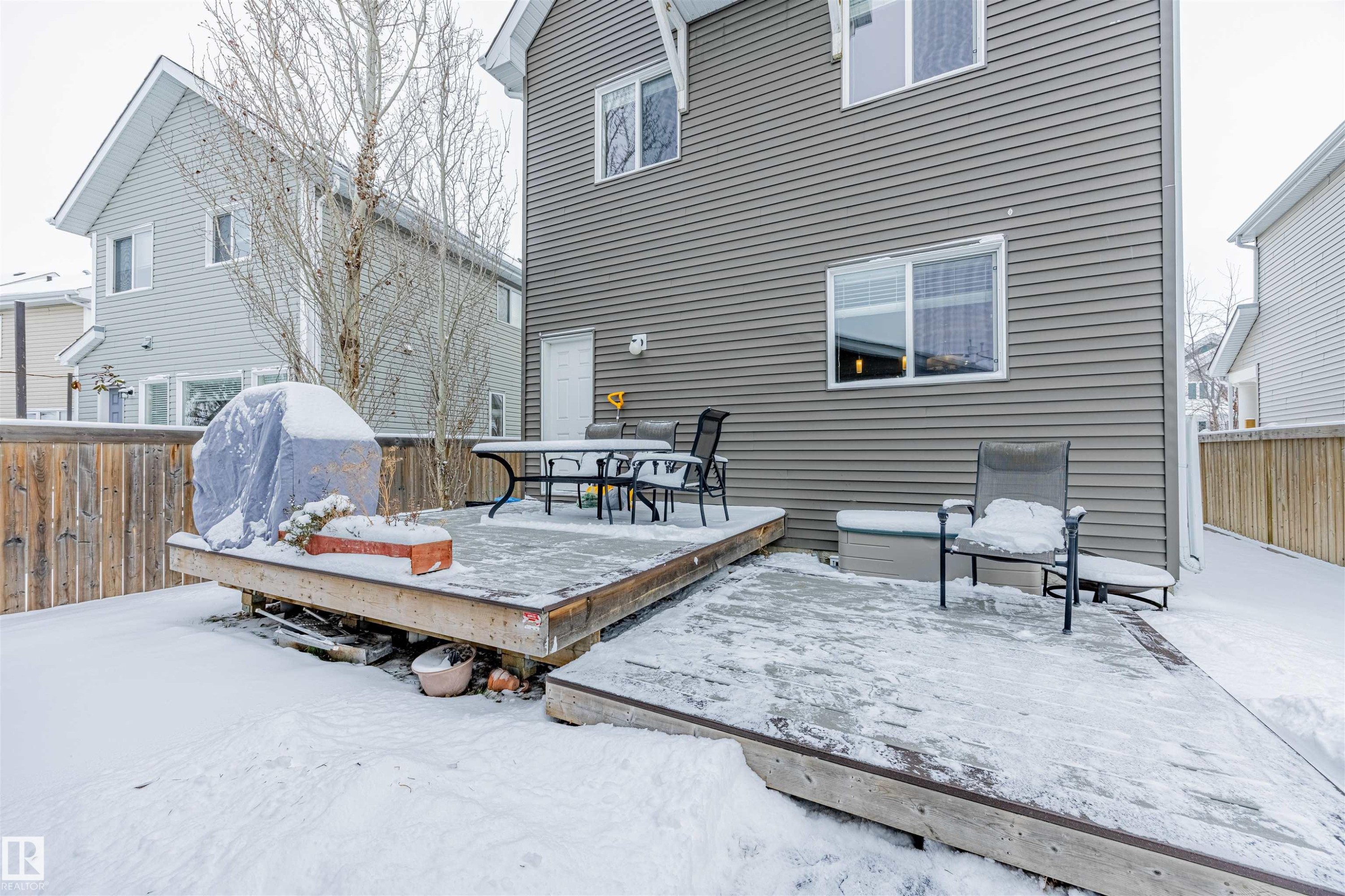 A view of the yard and the newer huge maintenance free deck. - 1312 74 Street, Edmonton, AB - Outdoor With Deck Patio Veranda With Exterior