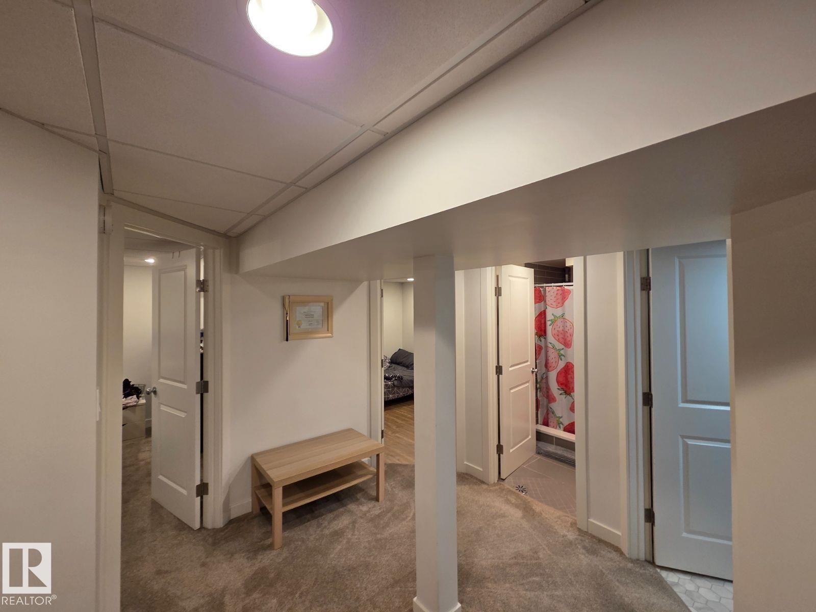 Finished below grade area with carpet and a drop ceiling - 12410 120 Avenue, Edmonton, AB - Indoor