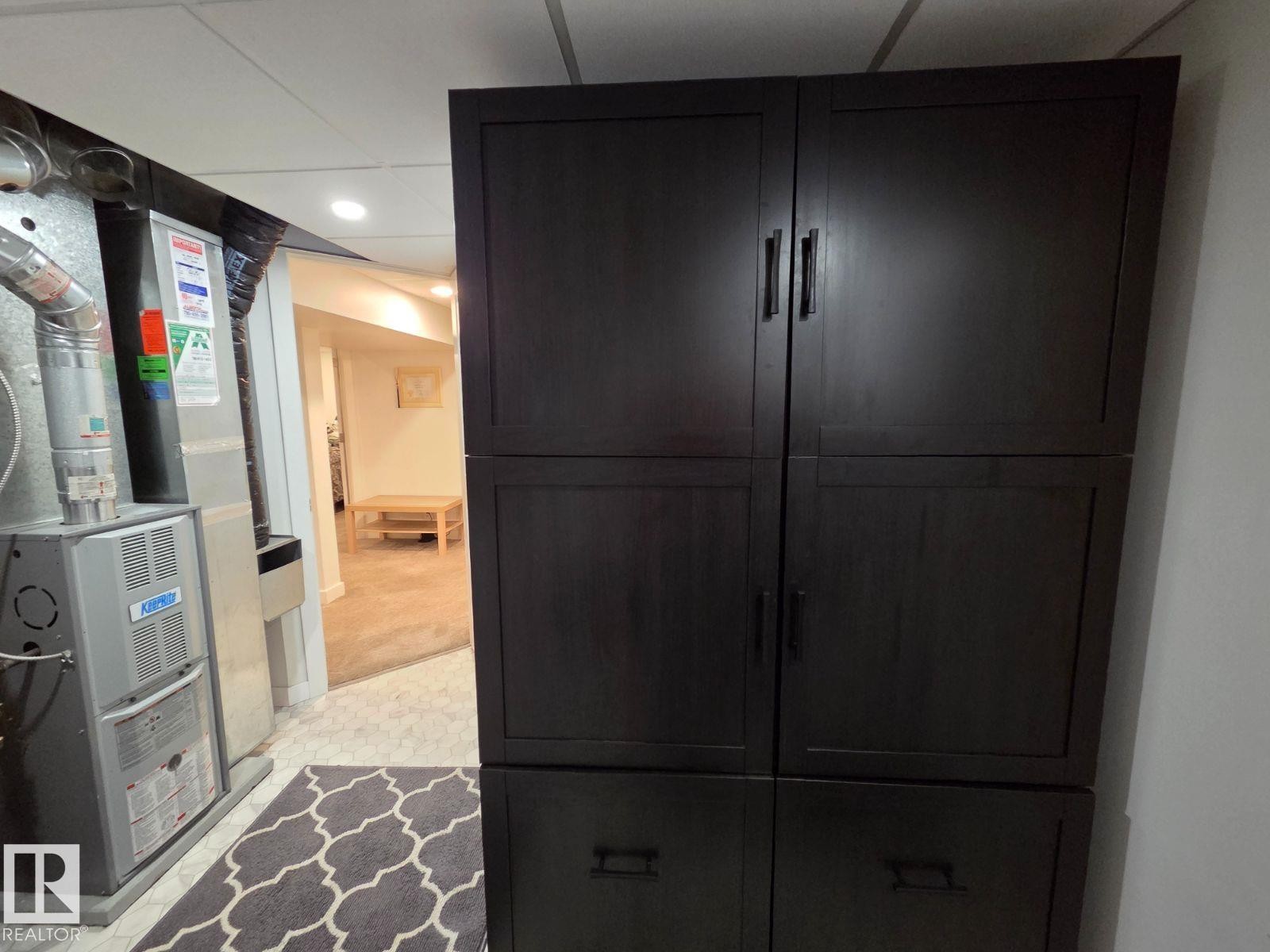 Interior space featuring heating unit - 12410 120 Avenue, Edmonton, AB - Indoor