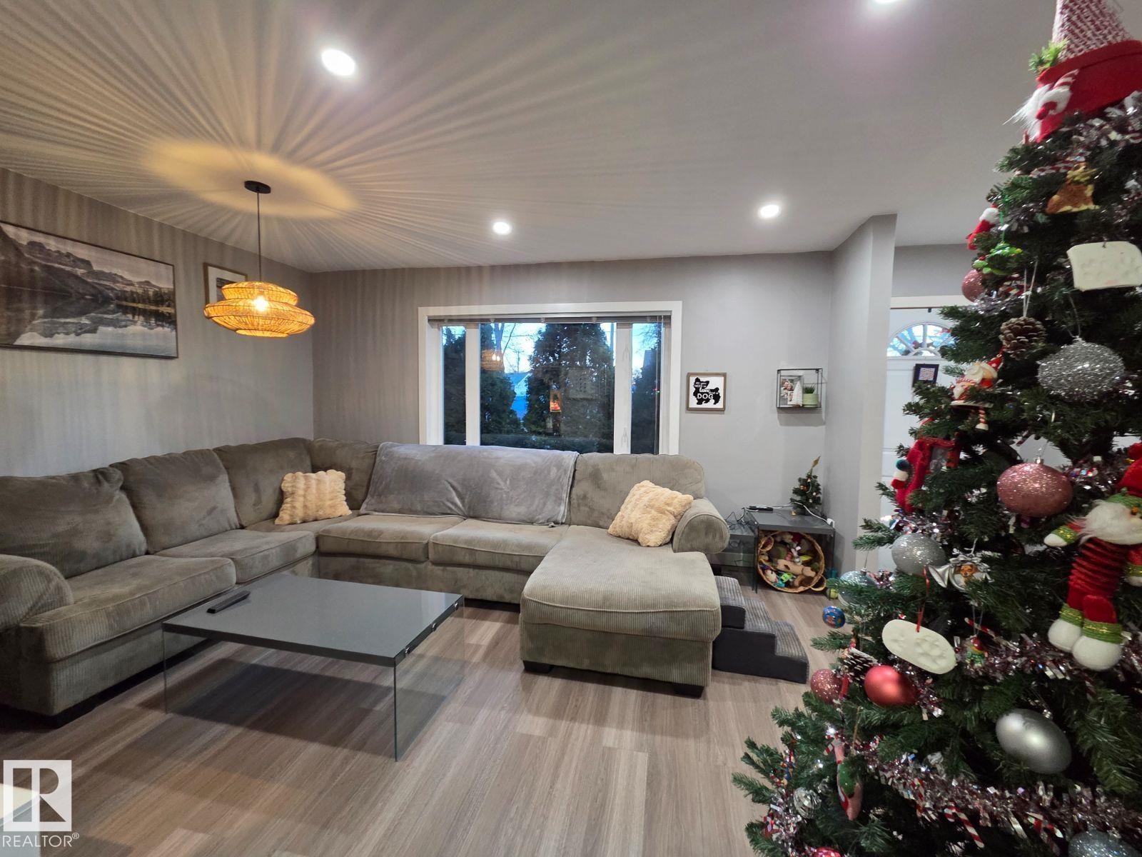 Living room featuring recessed lighting and wood finished floors - 12410 120 Avenue, Edmonton, AB - Indoor Photo Showing Living Room