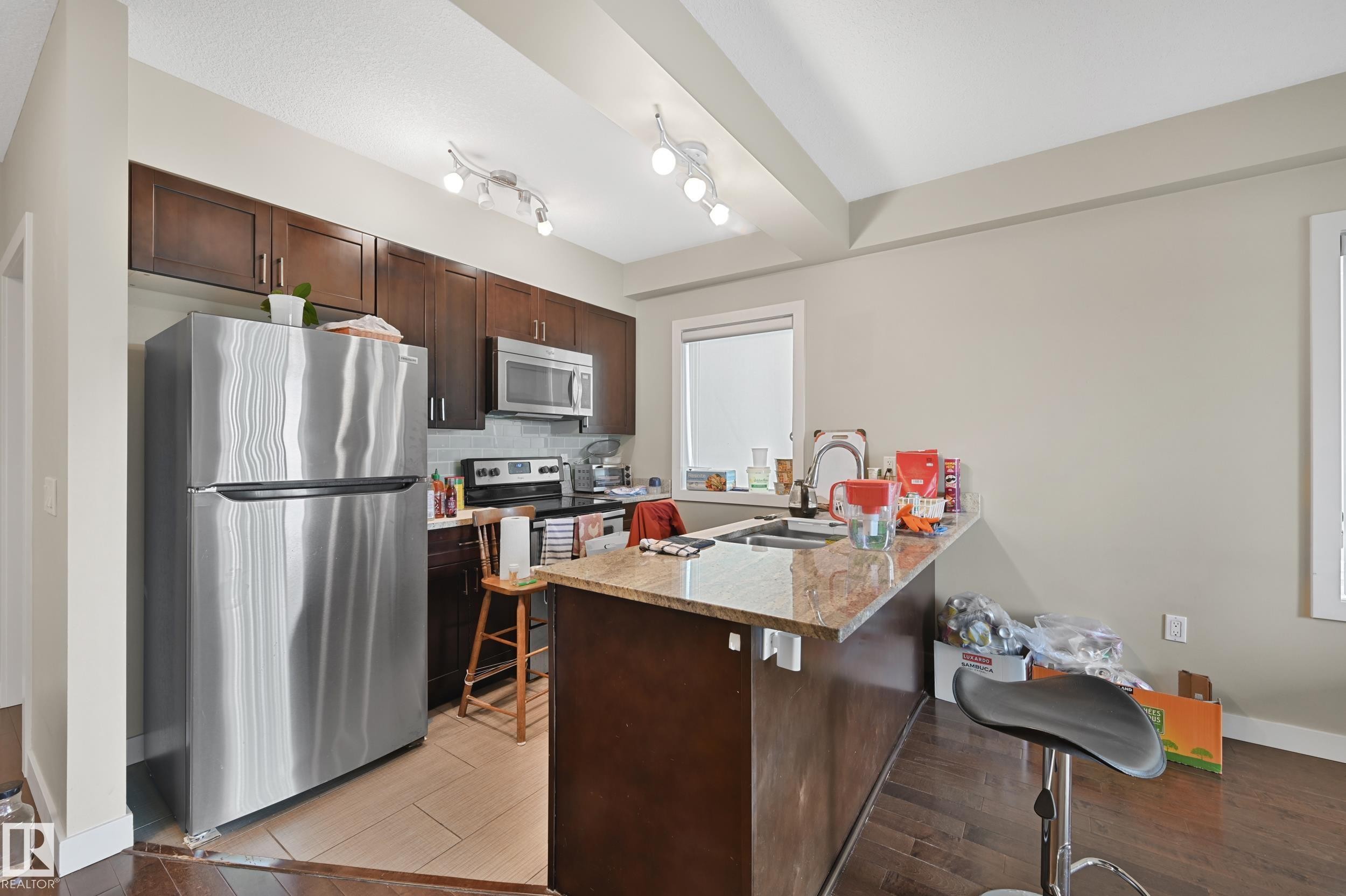 313 1230 Windermere Way, Edmonton, AB - Indoor Photo Showing Kitchen With Double Sink