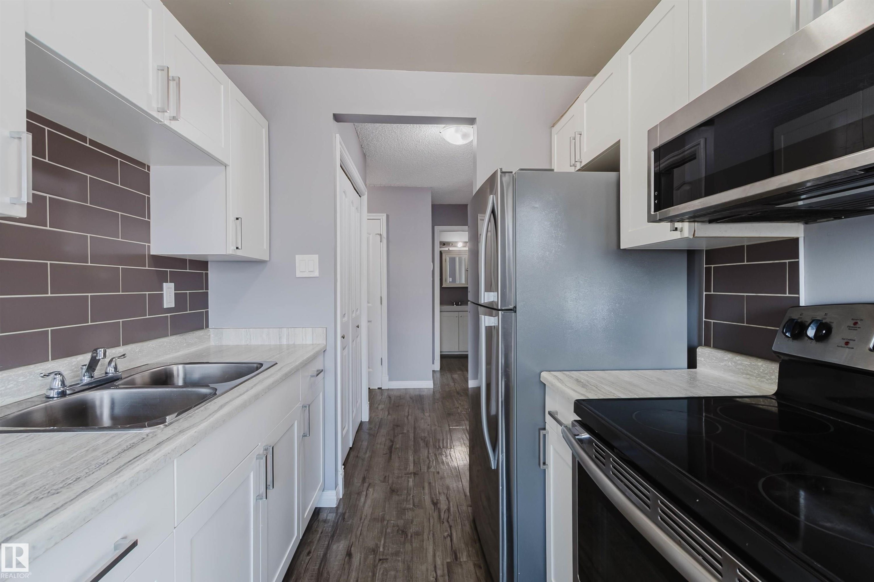 307 10140 151 Street, Edmonton, AB - Indoor Photo Showing Kitchen With Double Sink
