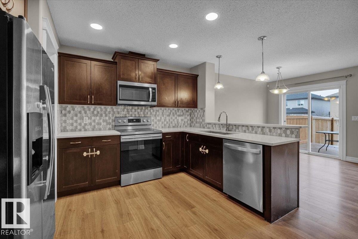 Edmonton, AB - Indoor Photo Showing Kitchen With Upgraded Kitchen