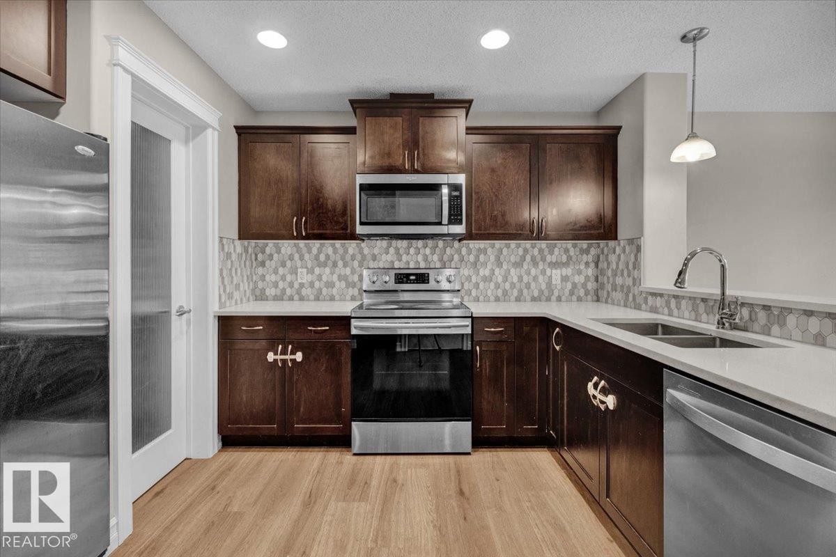 Edmonton, AB - Indoor Photo Showing Kitchen With Double Sink