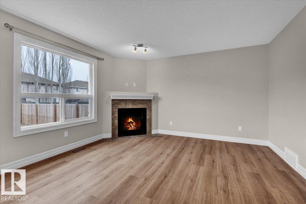Edmonton, AB - Indoor Photo Showing Living Room With Fireplace