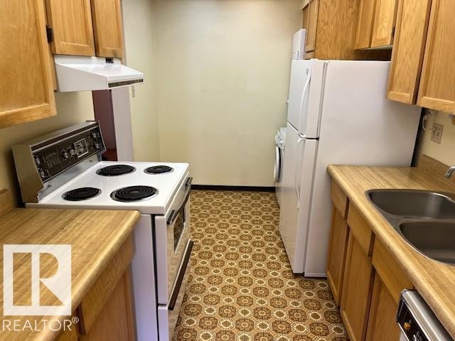 206 8149 111 Street, Edmonton, AB - Indoor Photo Showing Kitchen With Double Sink