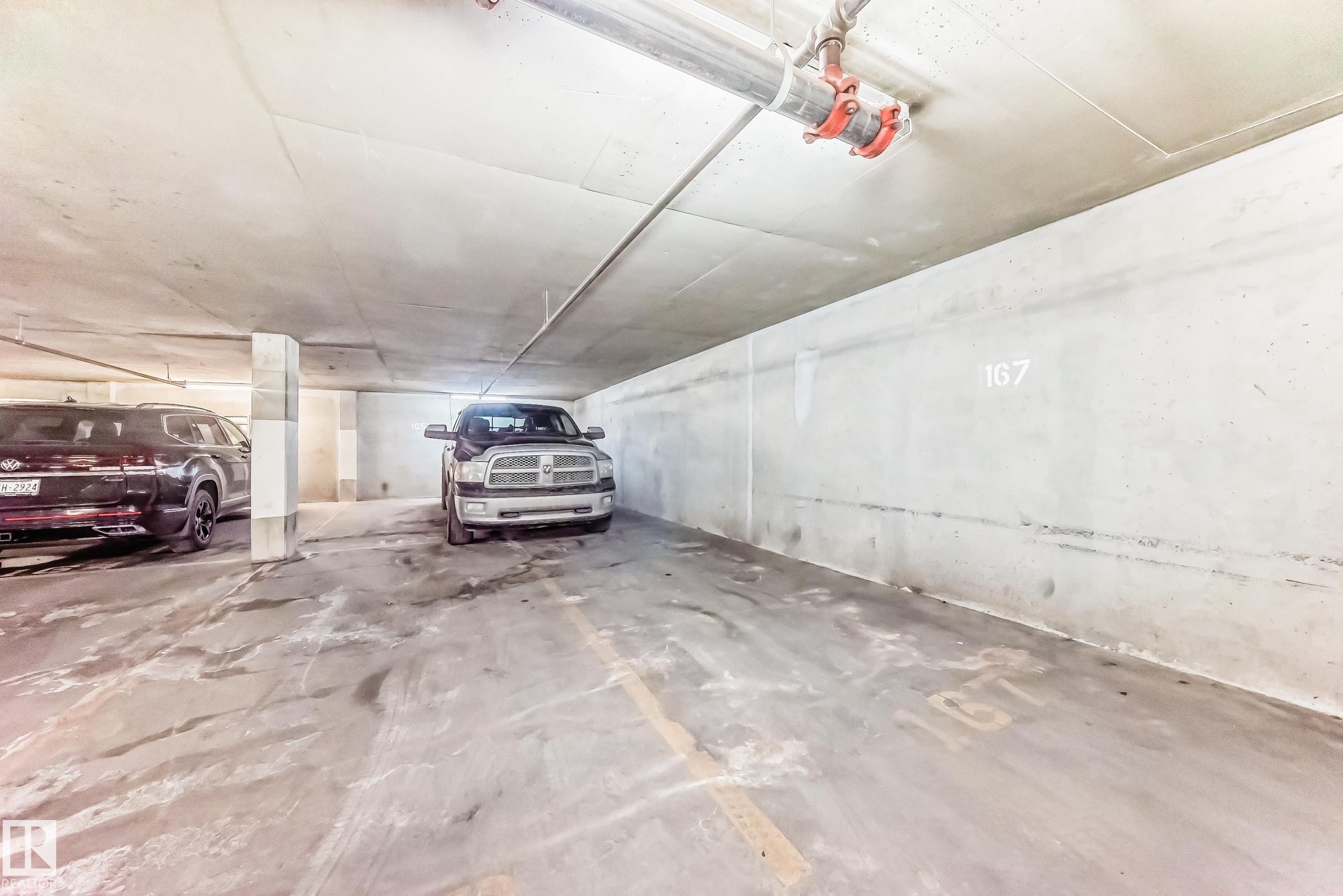 Parking deck with a garage door opener - 507 11716 100 Avenue, Edmonton, AB - Indoor Photo Showing Garage