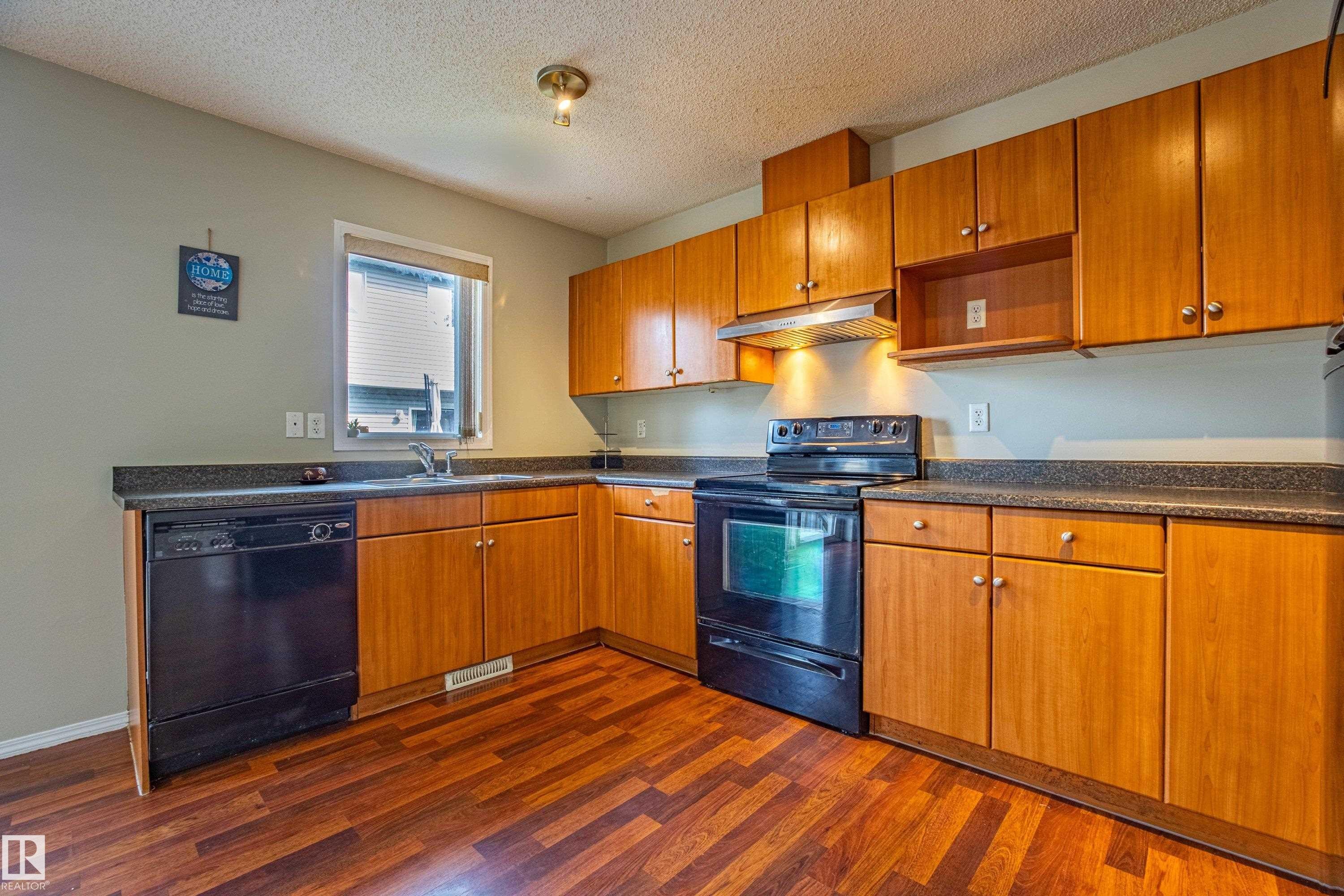 #51, 2503 24 Street, Edmonton, AB - Indoor Photo Showing Kitchen With Double Sink