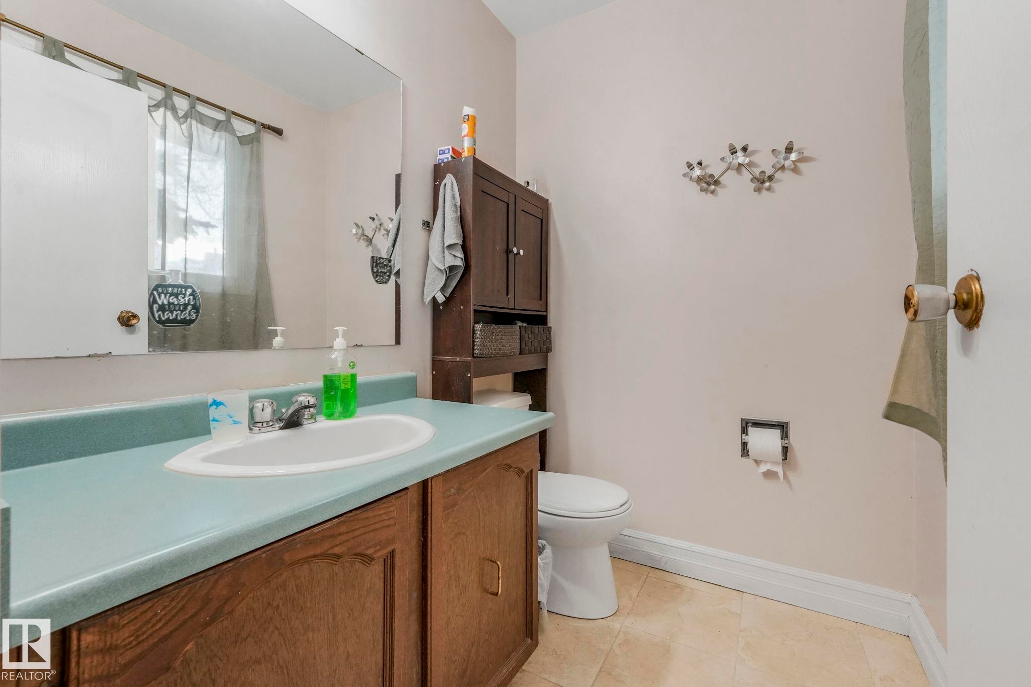 Full bath with vanity and light tile patterned flooring - 11811 32A Avenue, Edmonton, AB - Indoor Photo Showing Bathroom