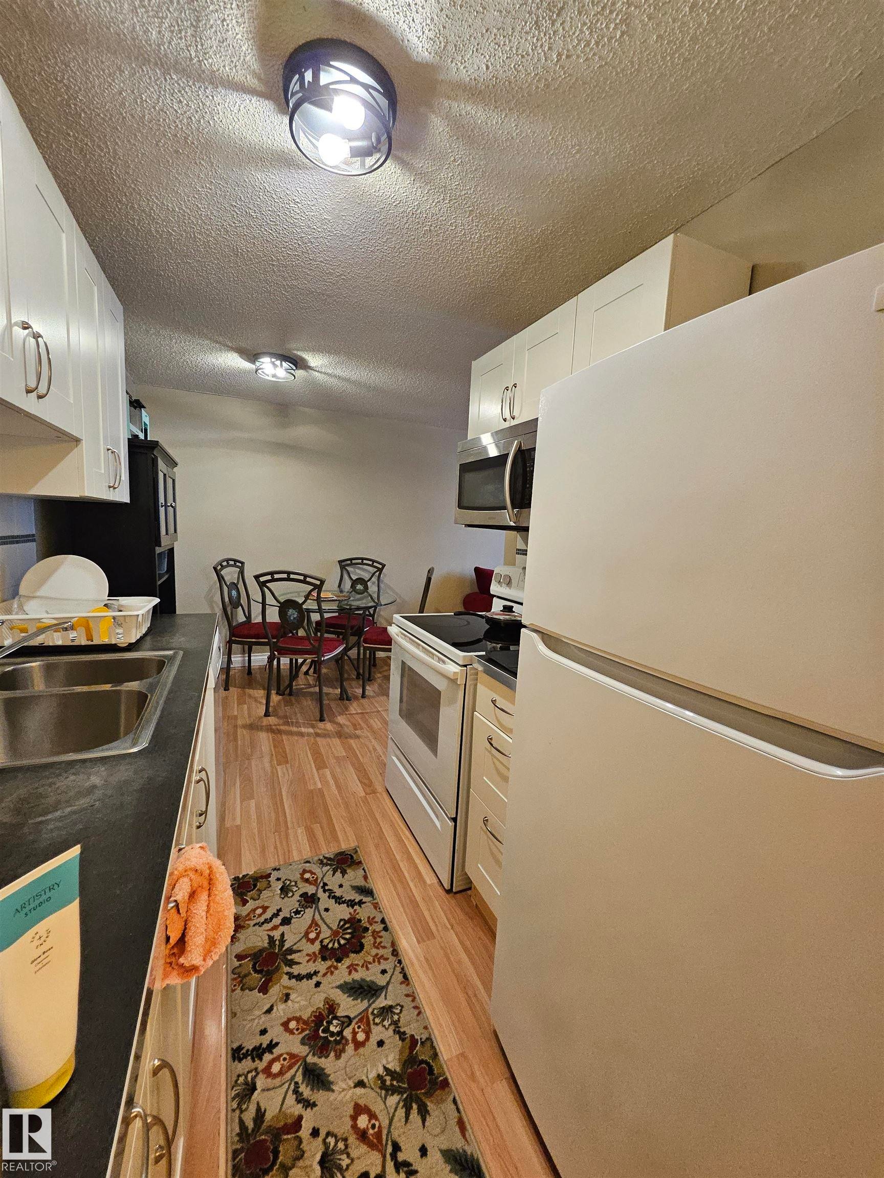 102 12223 82 Street, Edmonton, AB - Indoor Photo Showing Kitchen With Double Sink