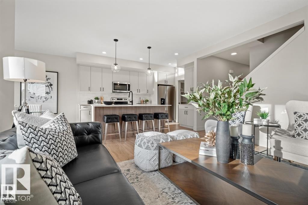 Living area with light wood-style flooring and recessed lighting - 24 Grayson Green, Stony Plain, AB - Indoor Photo Showing Living Room