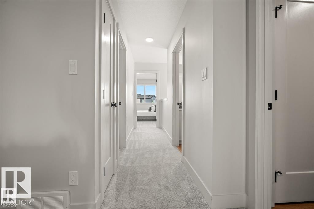 Corridor with light colored carpet and recessed lighting - 24 Grayson Green, Stony Plain, AB - Indoor Photo Showing Other Room