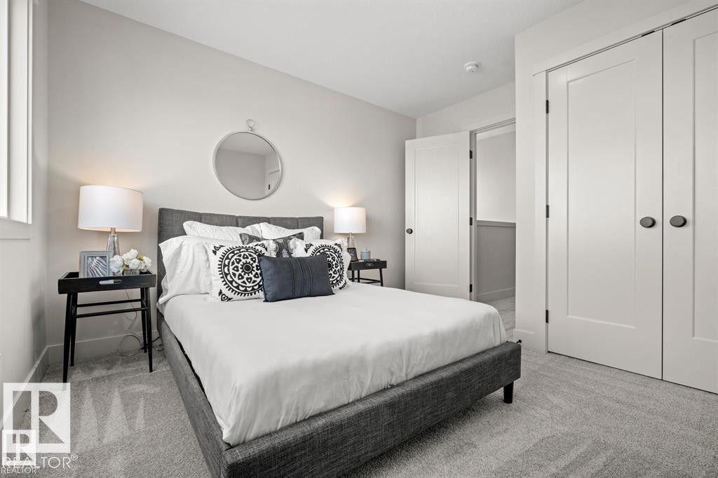 Bedroom with light carpet and a closet - 24 Grayson Green, Stony Plain, AB - Indoor Photo Showing Bedroom
