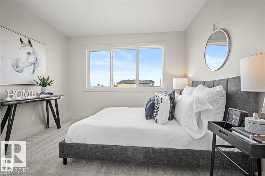 Bedroom with light carpet and baseboards - 24 Grayson Green, Stony Plain, AB - Indoor Photo Showing Bedroom