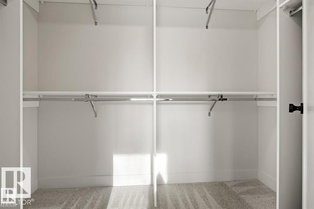 Spacious closet with carpet flooring - 24 Grayson Green, Stony Plain, AB - Indoor With Storage