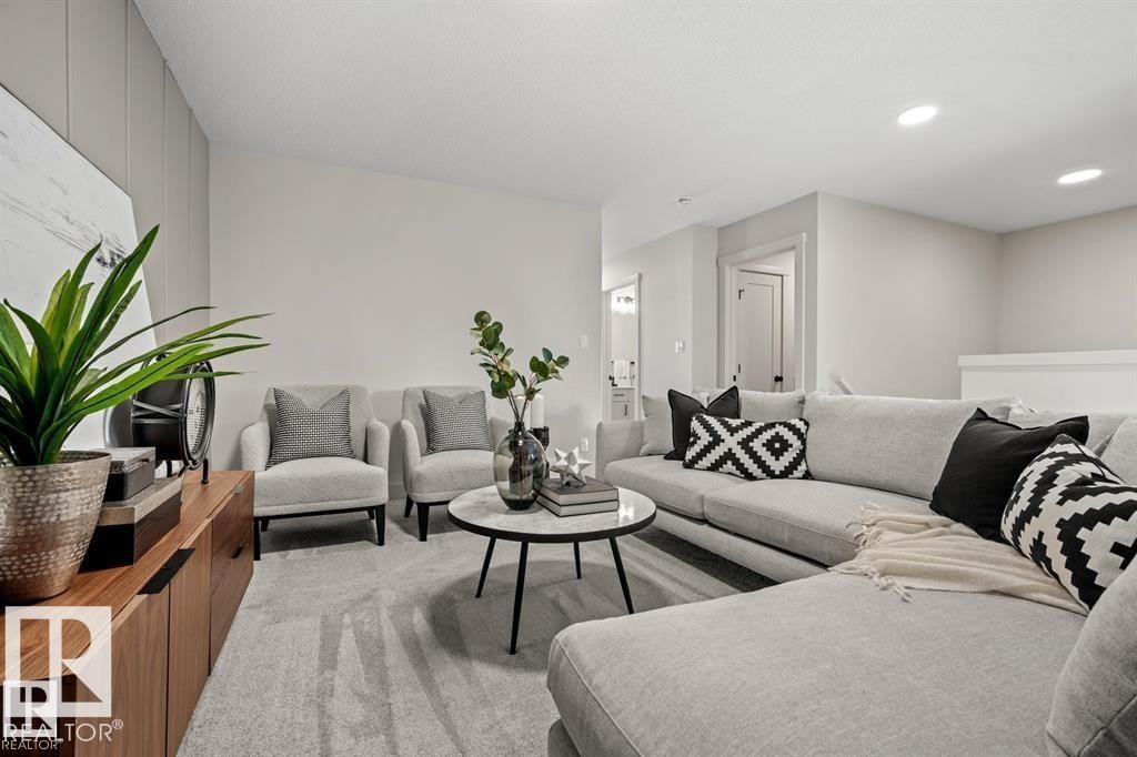 Carpeted living room featuring recessed lighting - 24 Grayson Green, Stony Plain, AB - Indoor Photo Showing Living Room