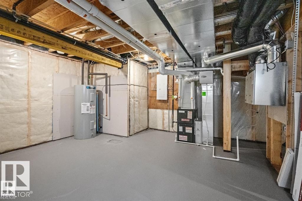 Unfinished below grade area with water heater, electric panel, and heating unit - 24 Grayson Green, Stony Plain, AB - Indoor Photo Showing Basement