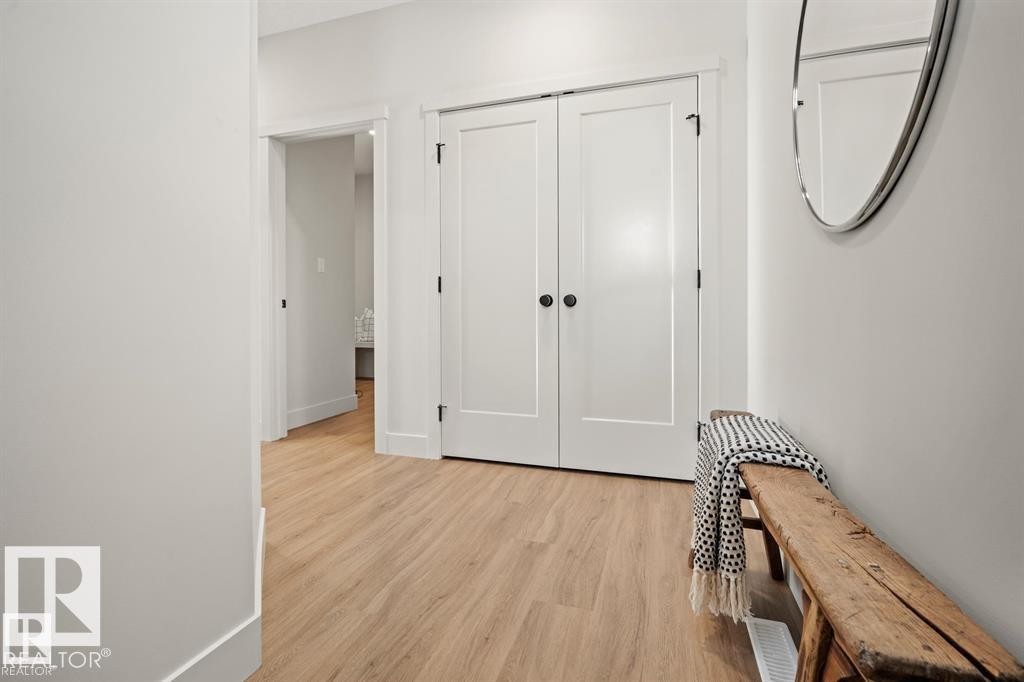 Hallway featuring light wood finished floors and baseboards - 24 Grayson Green, Stony Plain, AB - Indoor Photo Showing Other Room