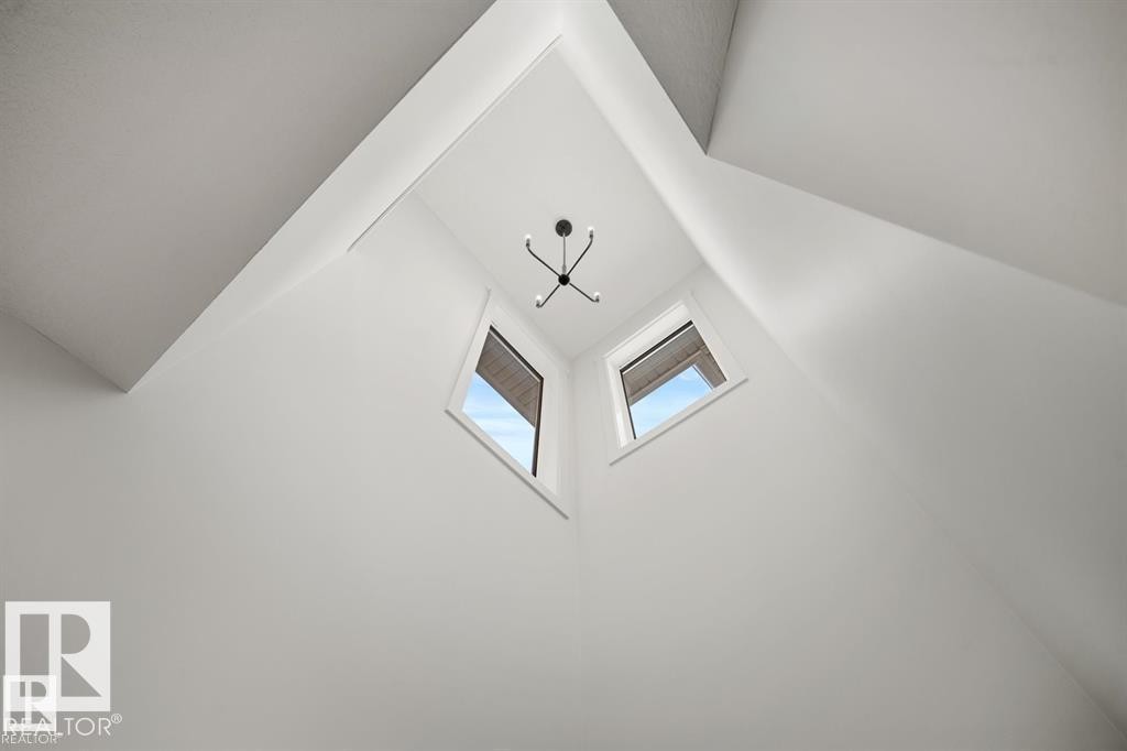 Detailed view of a chandelier - 24 Grayson Green, Stony Plain, AB - Indoor Photo Showing Other Room