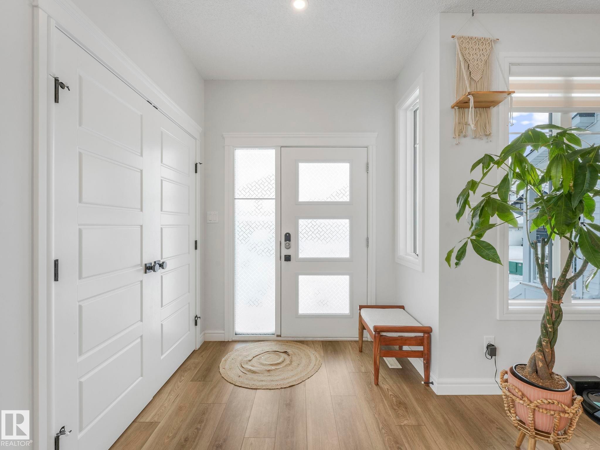 Entryway featuring light wood-style flooring and plenty of natural light - 4447 Kinsella Green, Edmonton, AB - Indoor Photo Showing Other Room