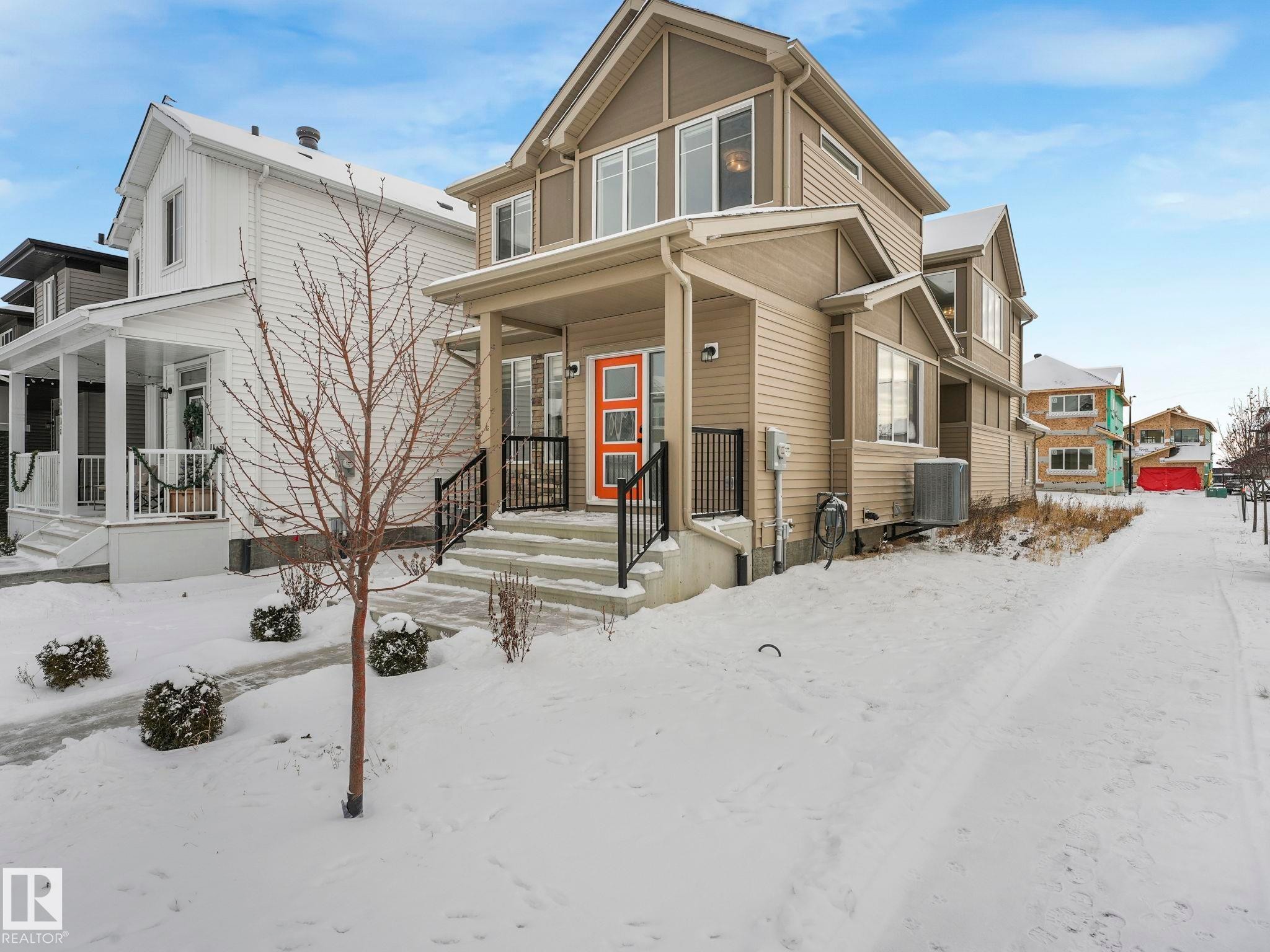 View of front of house featuring a porch - 4447 Kinsella Green, Edmonton, AB - Outdoor With Facade