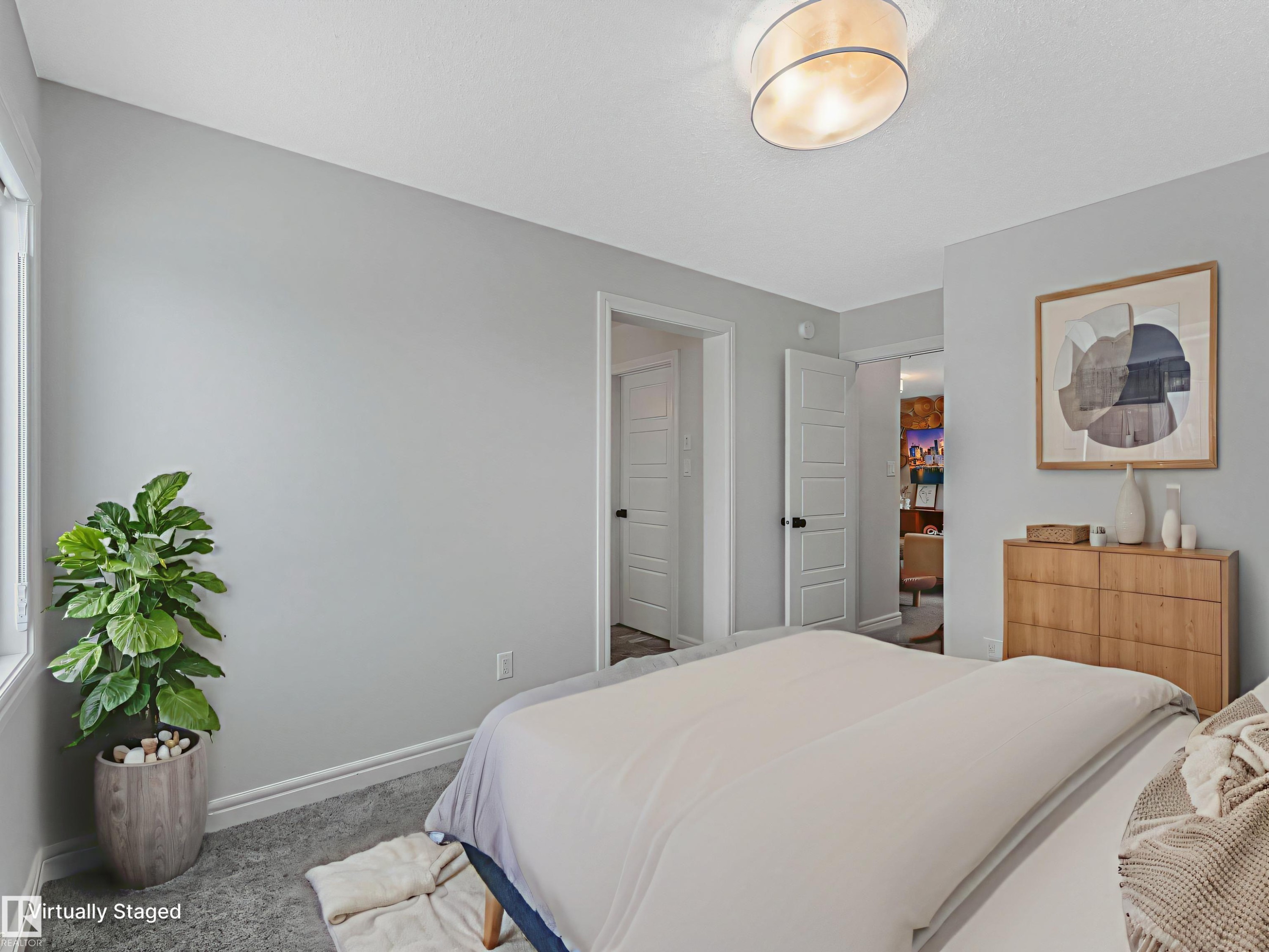 Carpeted bedroom featuring baseboards - 4447 Kinsella Green, Edmonton, AB - Indoor Photo Showing Bedroom