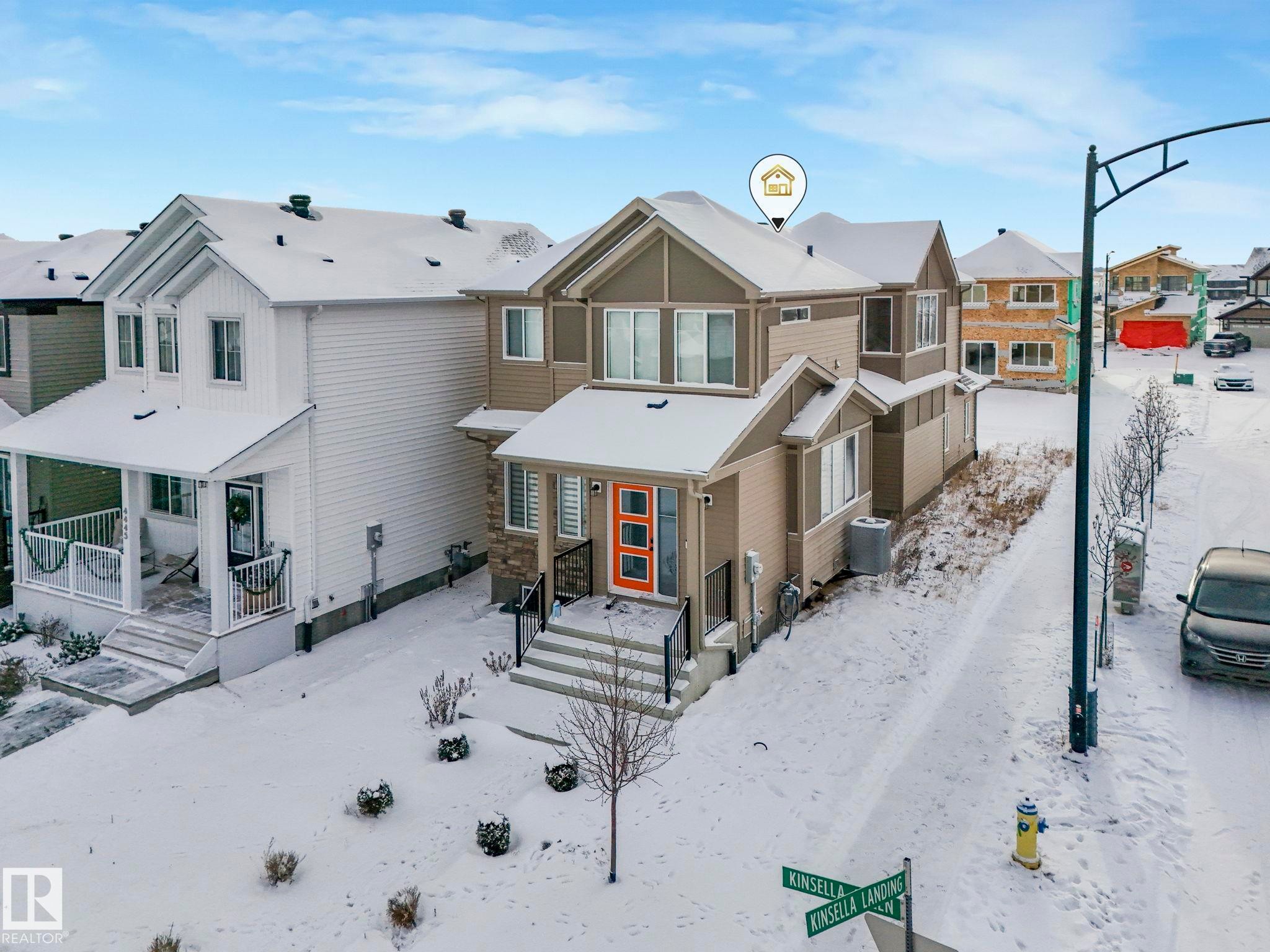 View of front of home featuring a residential view and stone siding - 4447 Kinsella Green, Edmonton, AB - Outdoor
