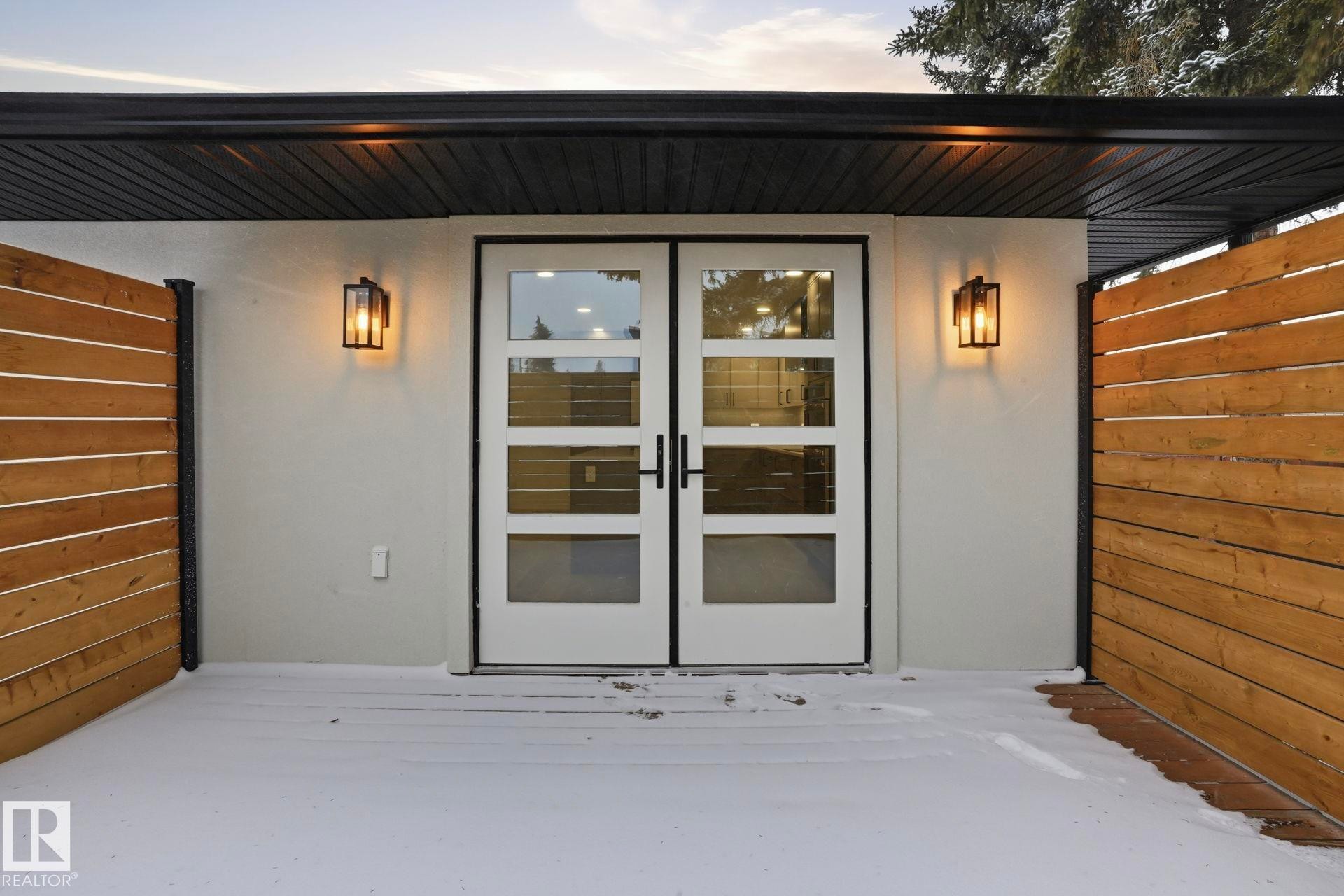 View of exterior entry featuring french doors - 14604 Mackenzie Drive, Edmonton, AB - Outdoor With Exterior
