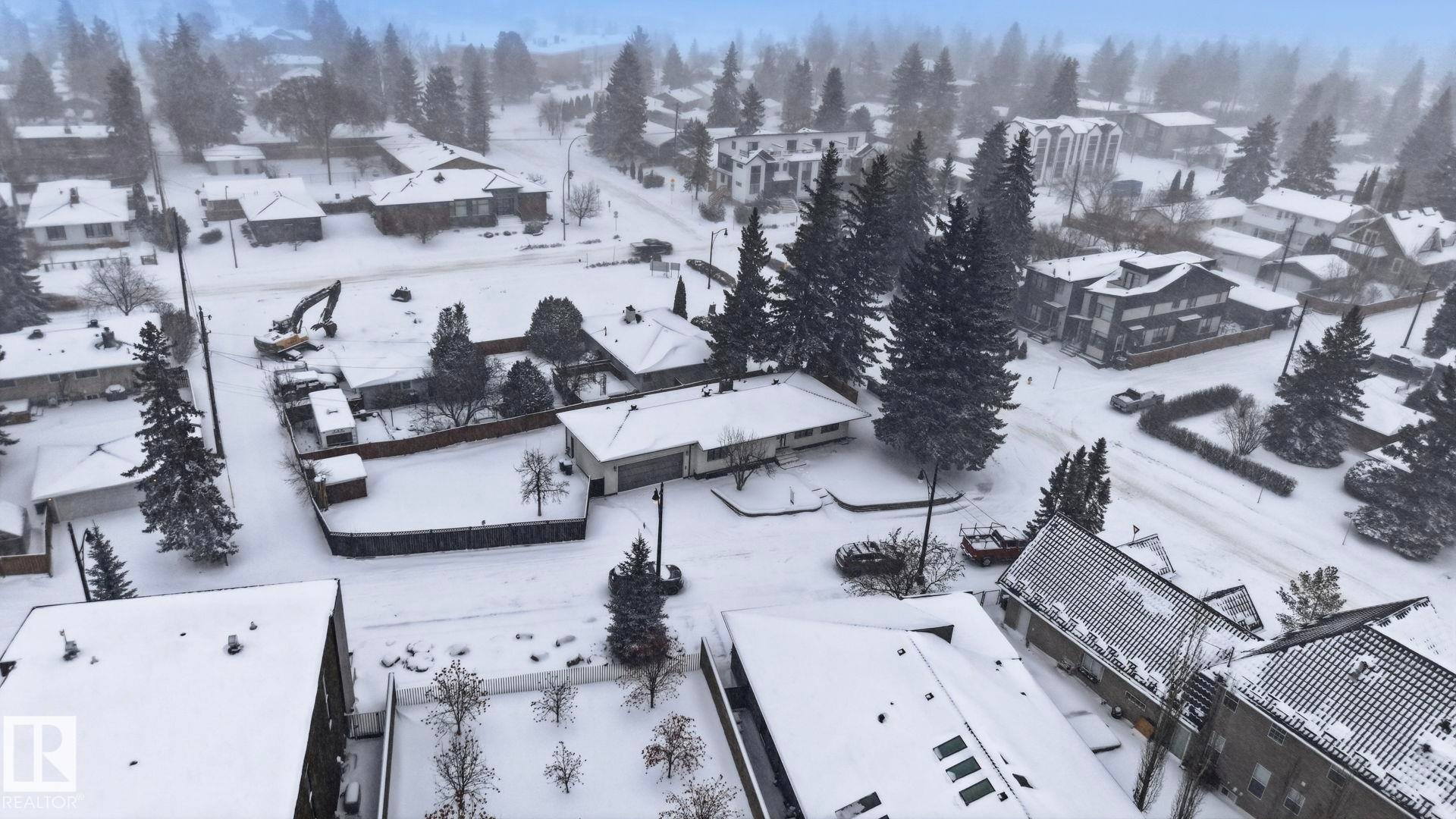 Snowy aerial view with a residential view - 14604 Mackenzie Drive, Edmonton, AB - Outdoor With View