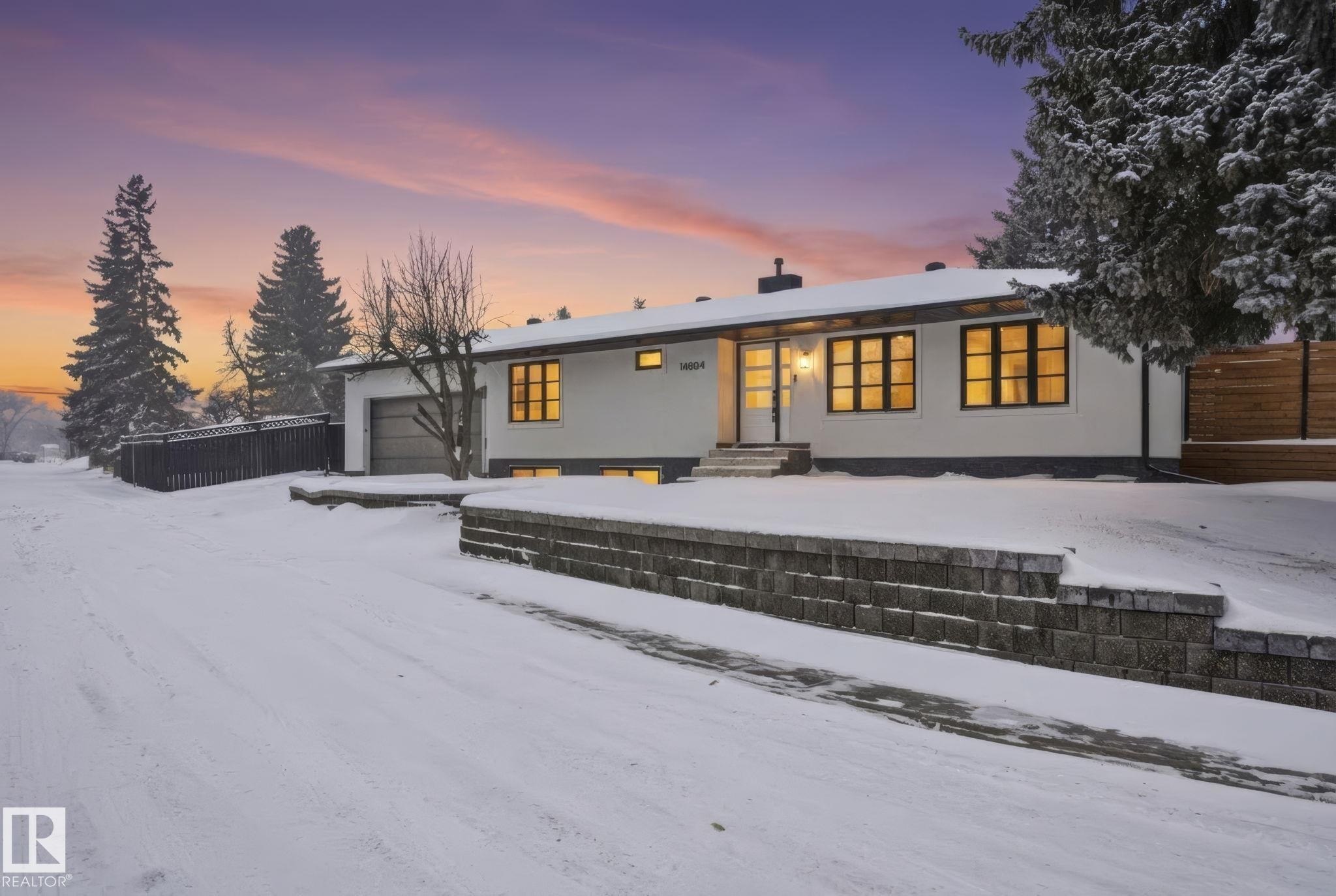 View of front facade with a garage and a chimney - 14604 Mackenzie Drive, Edmonton, AB - Outdoor
